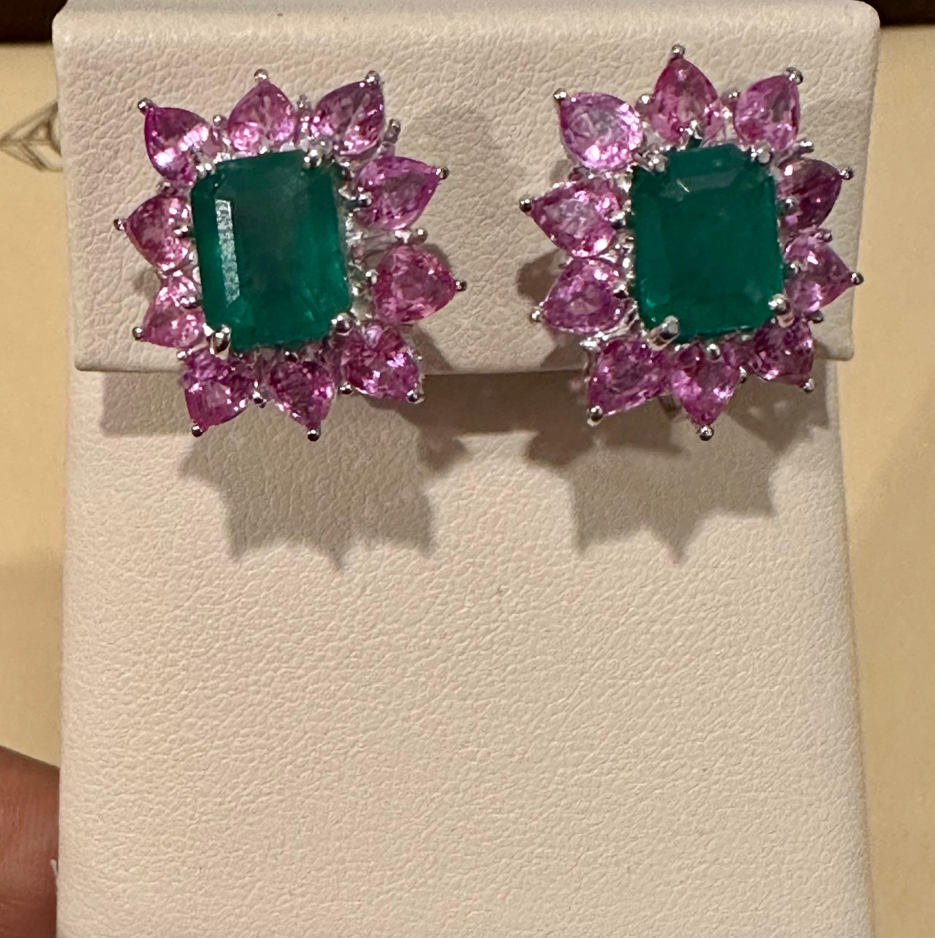 Vintage 5 Ct Natural Emerald Cut Emerald & Pink Sapphire Earrings Platinum
Approximately 5 Ct  Emerald Cut  Emerald  & Diamond Earrings surrounded by oval shape pink sapphire , made in platinum

This exquisite pair of earrings are beautifully