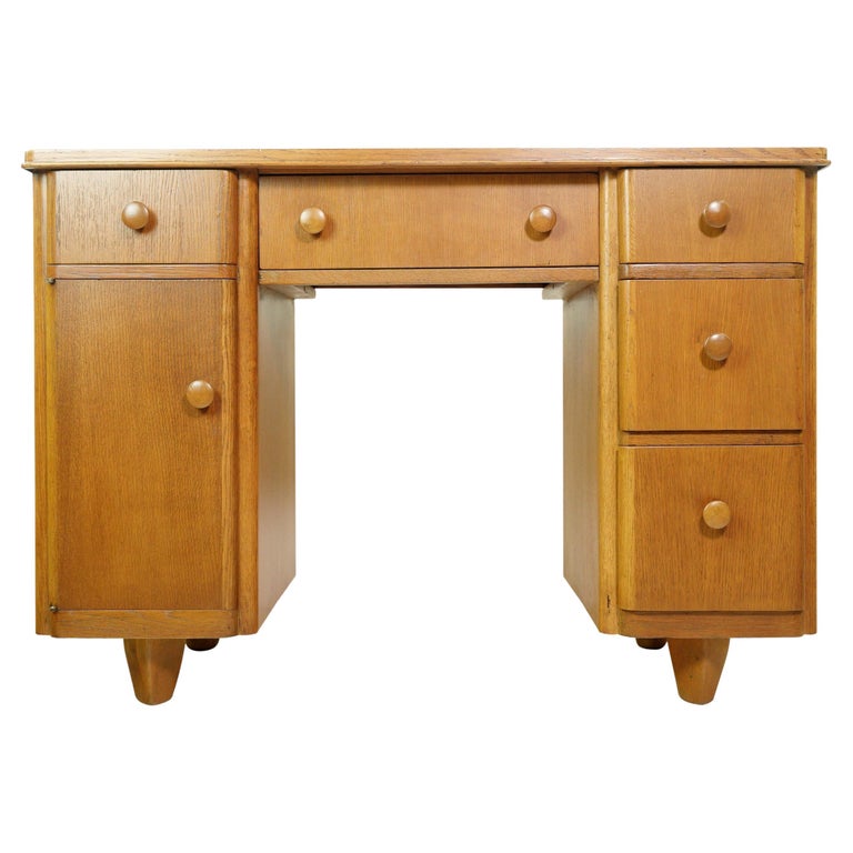 https://a.1stdibscdn.com/vintage-5-drawers-light-tone-wood-oak-office-desk-for-sale/f_9736/f_353107821689786645029/f_35310782_1689786646146_bg_processed.jpg?width=768