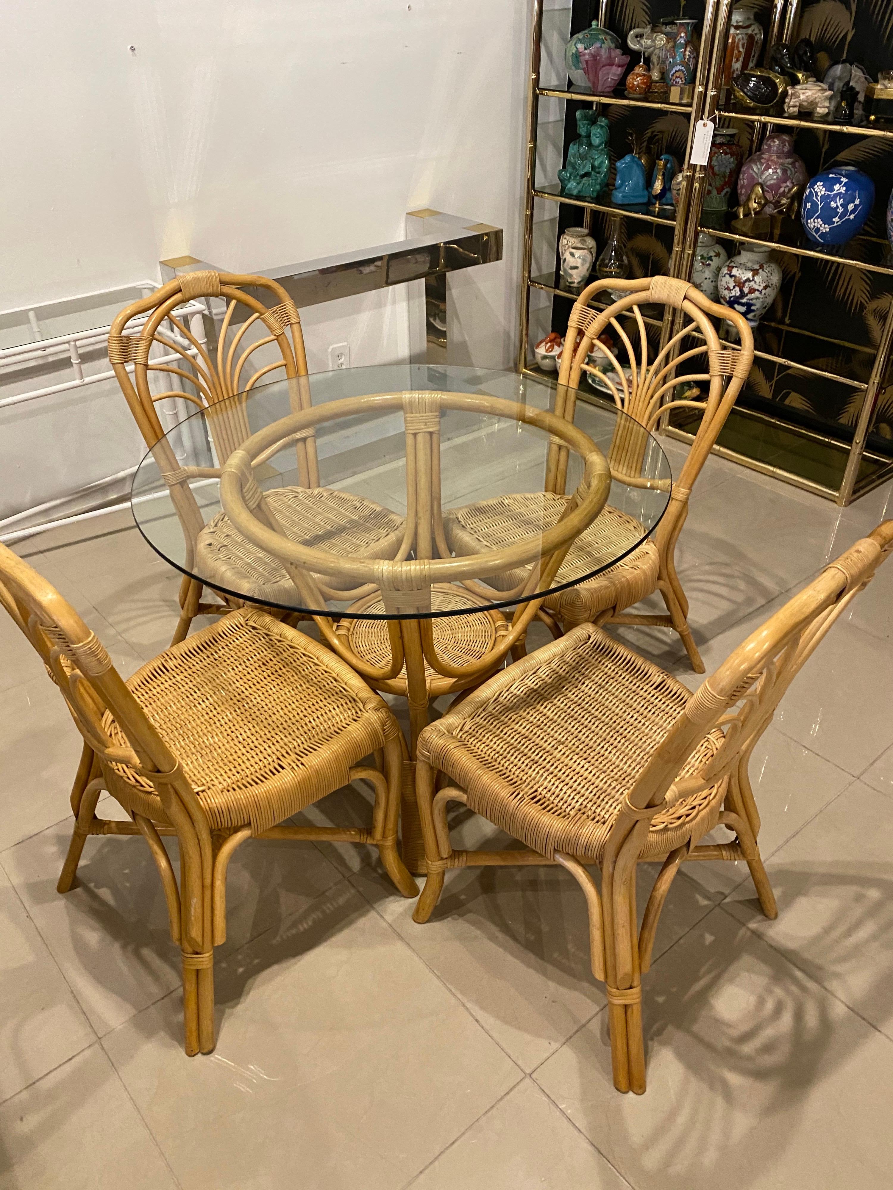 Vintage 5 piece rattan and wicker dining set. Includes 4 chairs and table base. Glass pictured is not included as it is used.
Table base measures 26 D x 30 H. Chair sizes are below.
Seat depth is 16
