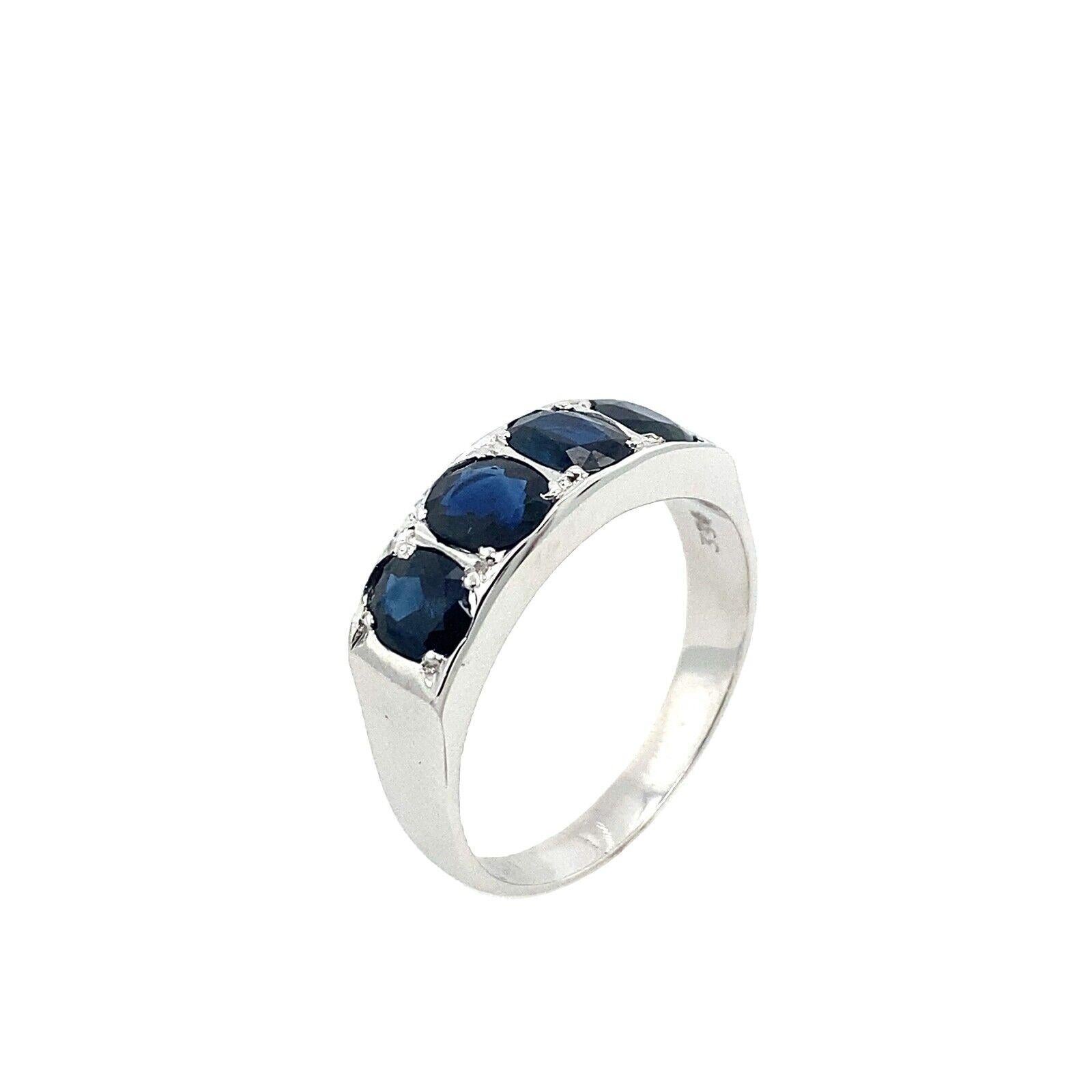 This 8ct white gold 4-stone ring set with oval natural sapphires. This ring is elegant and beautiful.

Additional Information:
Total Sapphires Weight: 2ct
Width of Band: 2.8mm
Width of Head: 6.2mm
Length of Head: 18mm
Total Weight: 4.6g
Ring Size: