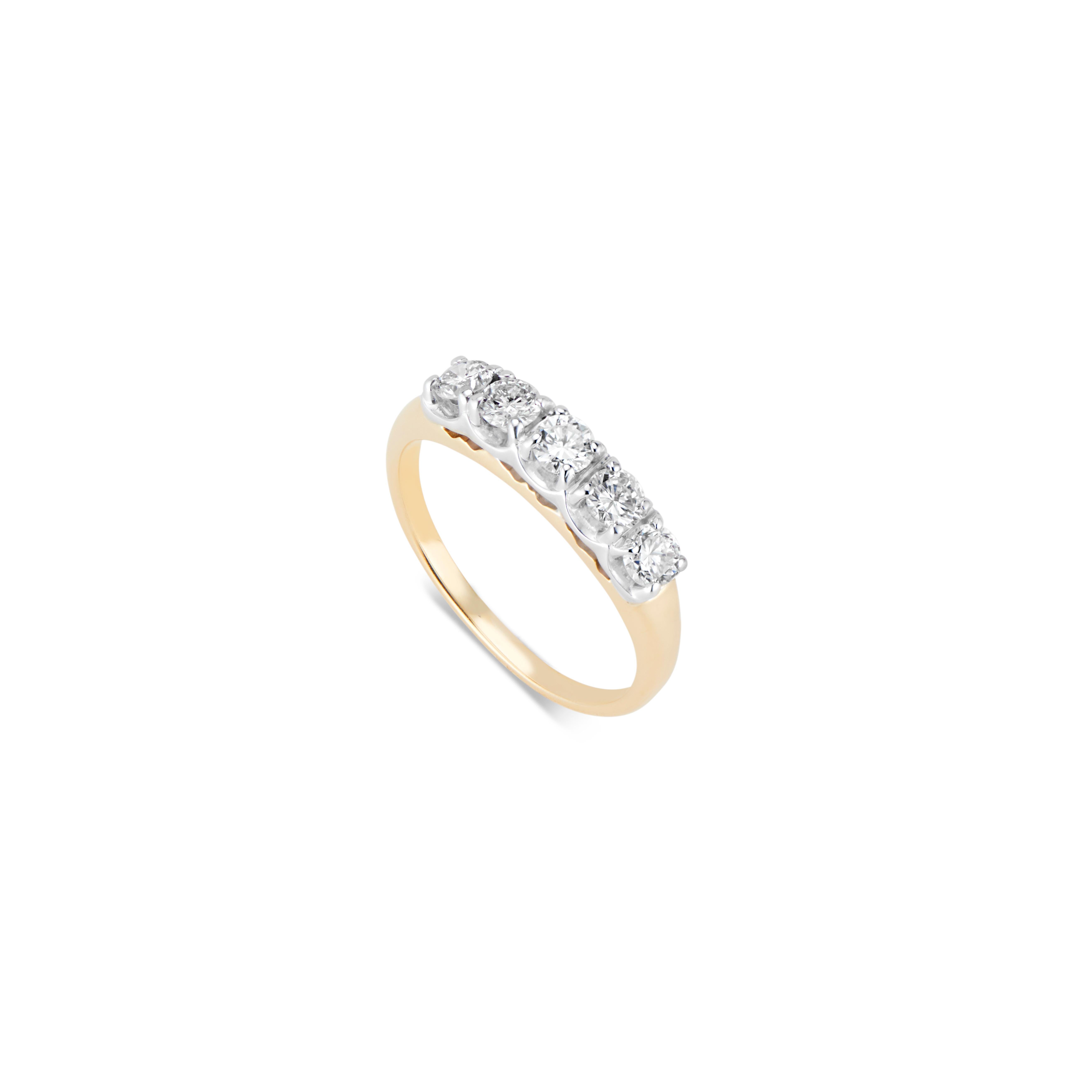 A stunning Vintage 14k Yellow Gold 5 Stone ring in excellent condition.
Five Diamonds, same size .20pt  - excellent colour and clarity set in 14k White gold prong setting, maximizing the sparkle and scintillation on a 14k yellow band.
Five stones