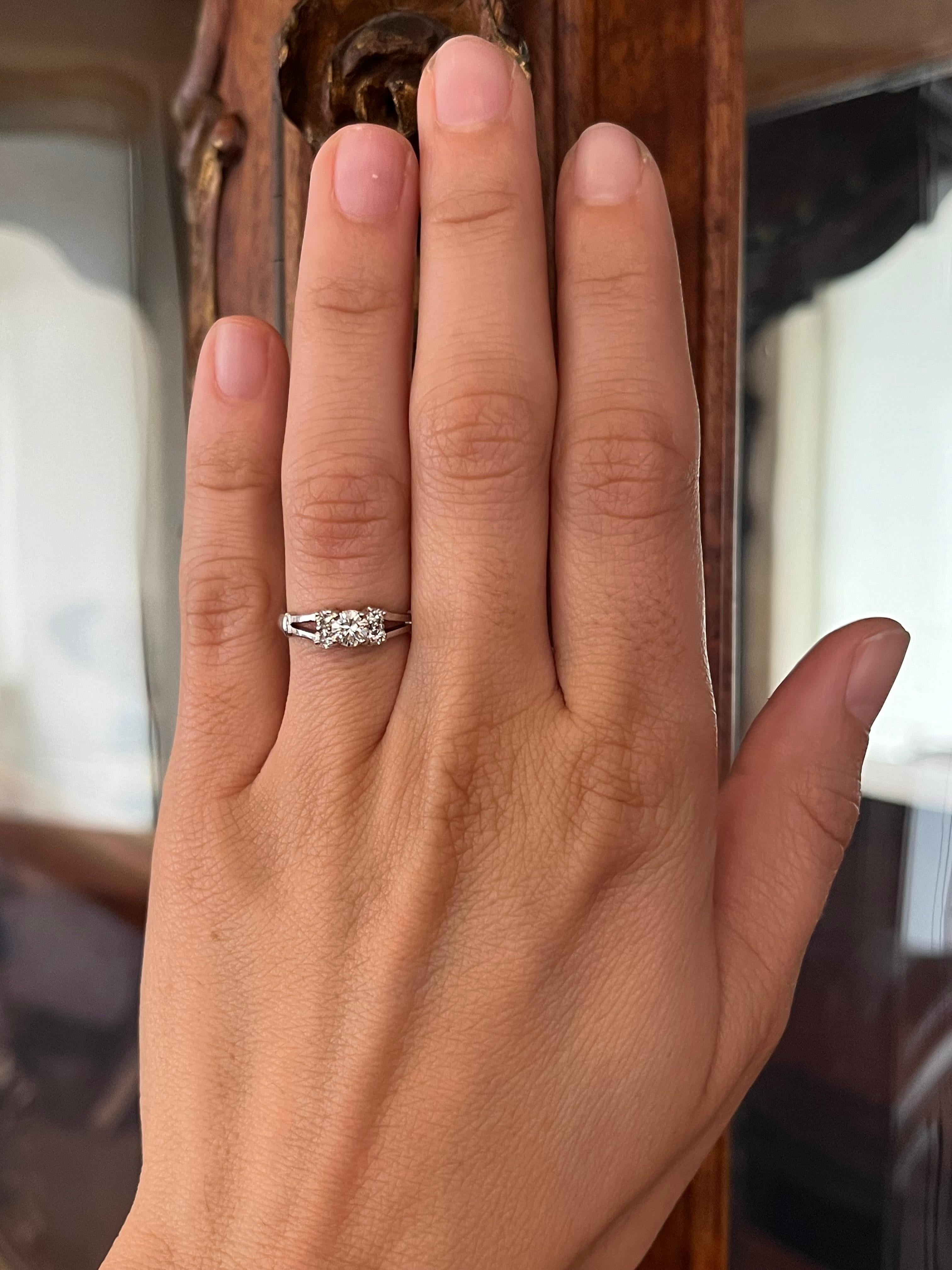 A graceful five-stone design featuring a 0.25ct center diamond, flanked by four side diamonds totaling 0.16ct. The diamonds are set in sleek 18K white gold, a refined expression of vintage charm. From our estate collection.

- Center Stone: 0.25ct