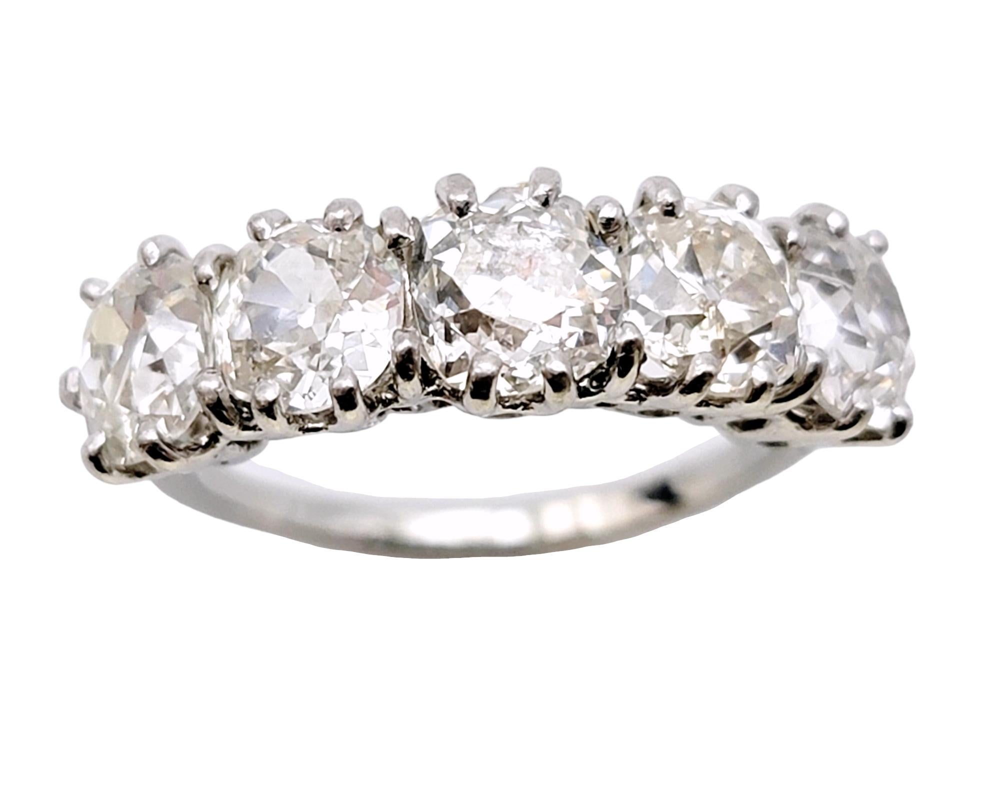 Ring size: 7

This stunningly sparkly vintage 5 stone semi-eternity band ring absolutely radiates on the finger. The glamourous Old World design paired with the sizable natural diamonds, makes this piece a true treasure. 
 
This classic beauty