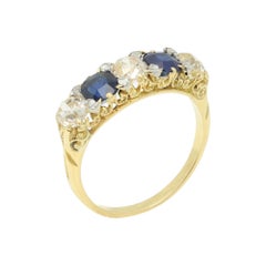 Anillo vintage de 5 piedras con diseño de filigrana de zafiros y diamantes, en oro de 18 quilates