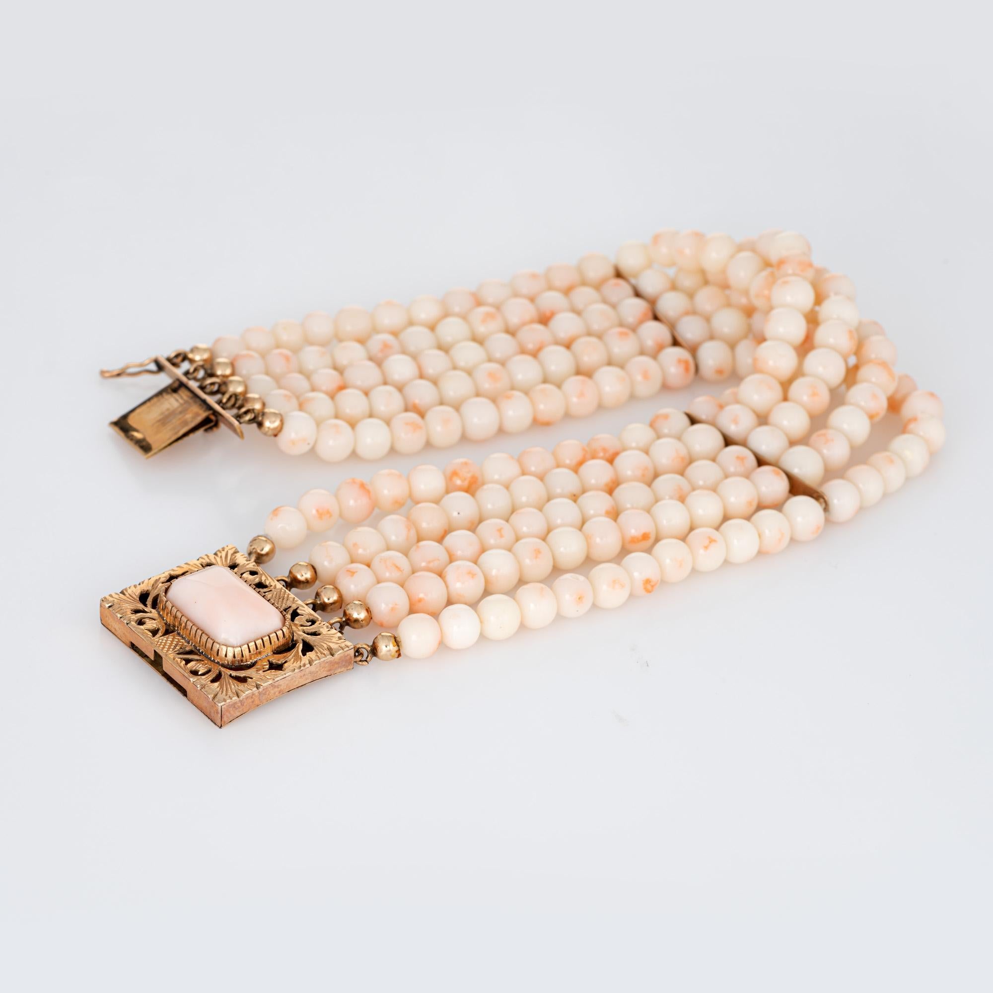 Finely detailed vintage angel skin coral bracelet finished with a 14 karat yellow gold clasp (circa 1950s to 1960s). 

5 strands of angel skin coral beads are uniform in size measuring 5mm each. The clasp is set with a 14mm x 8mm piece of angel skin
