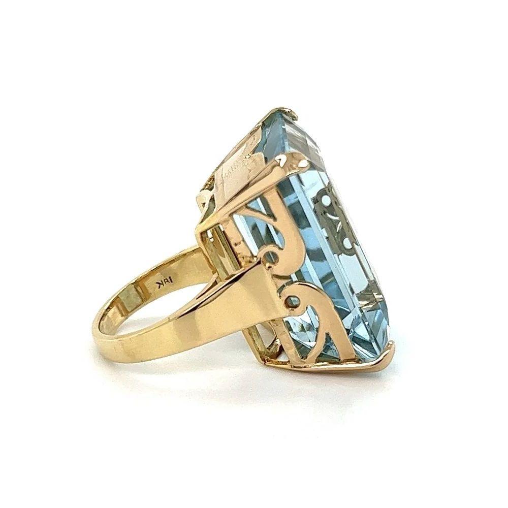 Simply Beautiful! Aquamarine Gold Cocktail Ring. Featuring a Gorgeous securely Hand set Aquamarine Gemstone, weighing approx. 50 Carat. Engraved gallery. Hand crafted 18K Yellow Gold mounting. Ring size 6, we offer ring resizing. Ideal worn alone or