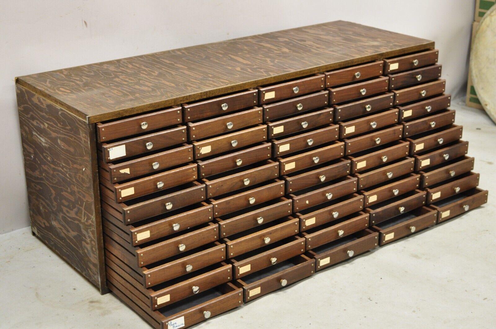 Vintage 50 Drawer Wooden Watchmakers Parts Tool Cabinet Storage Chest. Item features 50 metal lined drawers, lots of storage, quality craftsmanship. Circa Mid to late 20th century. Measurements: 18