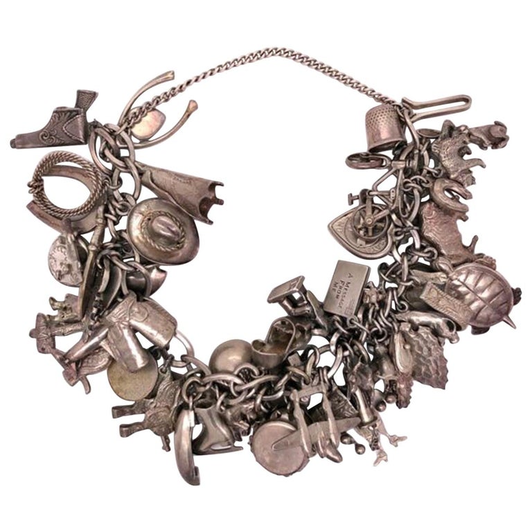 Vintage 50 Piece Sterling Silver Charm Bracelet Great Estate Jewelry Find For Sale at 1stdibs
