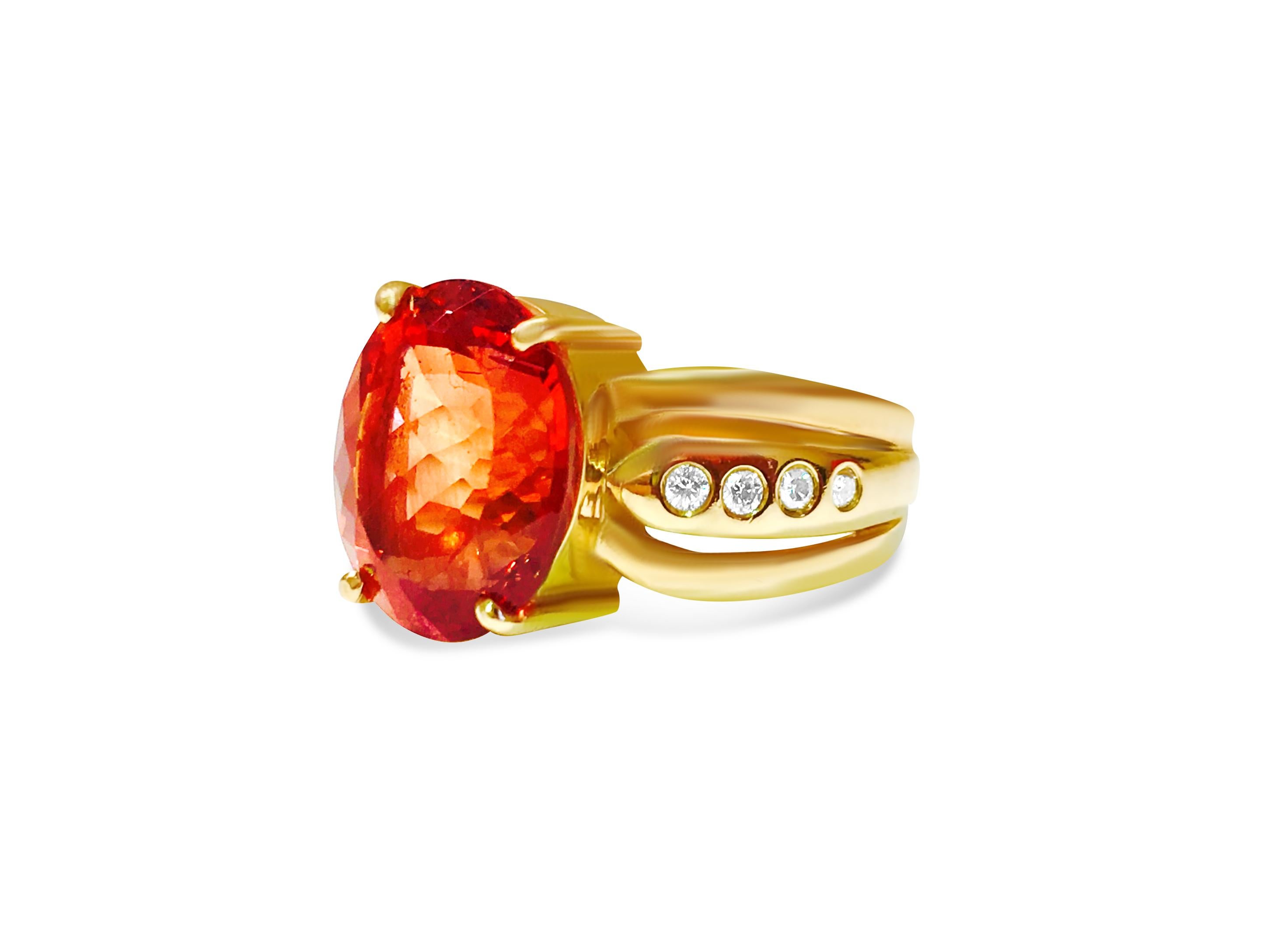 Metal: 14k Yellow Gold. 

Center: 5.00 Carat orange beryl. Oval cut, set in prongs. 100% natural earth mined gemstone.

Side diamonds: 0.32 cwt. G color and VS-SI clarity. Round brilliant cut diamonds set in flush setting. 100% natural earth mined