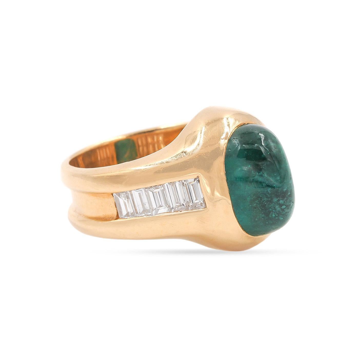 Vintage 5.04 Carat Oval Emerald Cabochon & Baguette Cut Diamond Ring composed of 18k yellow gold. With a 5.04 carat Natural Zambian oval cabochon emerald, PGS certified Vivid Green with Traditional Oil Enhancement. Ring also features 10 Baguette Cut