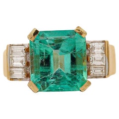 Vintage 5.06 Carat Emerald and Baguette Diamond in 18K Gold Ring Vintage 5.06 Carat Emerald and Baguette Diamond in 18K Gold Ring