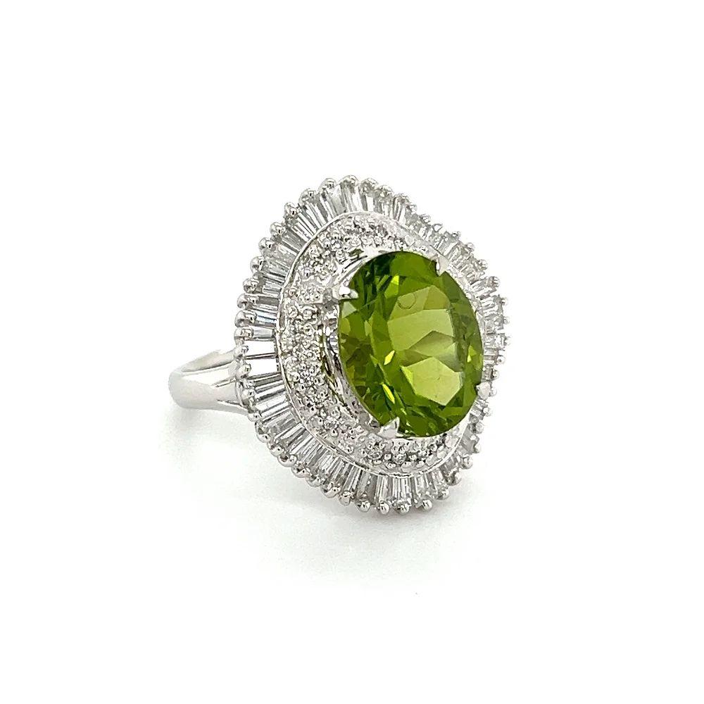 Simply Beautiful! Finely detailed Vintage Peridot and Diamond Platinum Cocktail Ring. Centering a securely nestled Hand set 5.06 Carat Oval Peridot, surrounded by Diamonds, weighing approx. 1.60tcw. Hand crafted Platinum mounting. Ring size 6.5, we