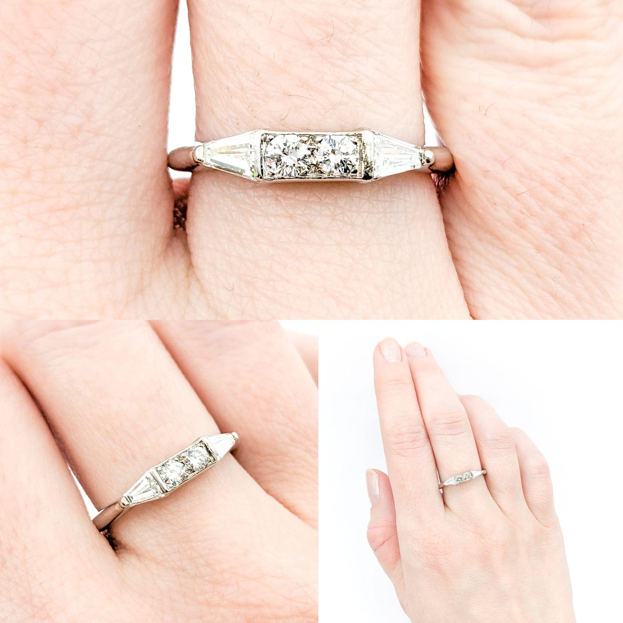 Vintage .50ctw Diamond Ring In Platinum



This elegant vintage ring, meticulously crafted in 900pt platinum, showcases a stunning combination of .50ctw round and tapered baguette diamonds, exuding a brilliant sparkle. The diamonds are of SI clarity