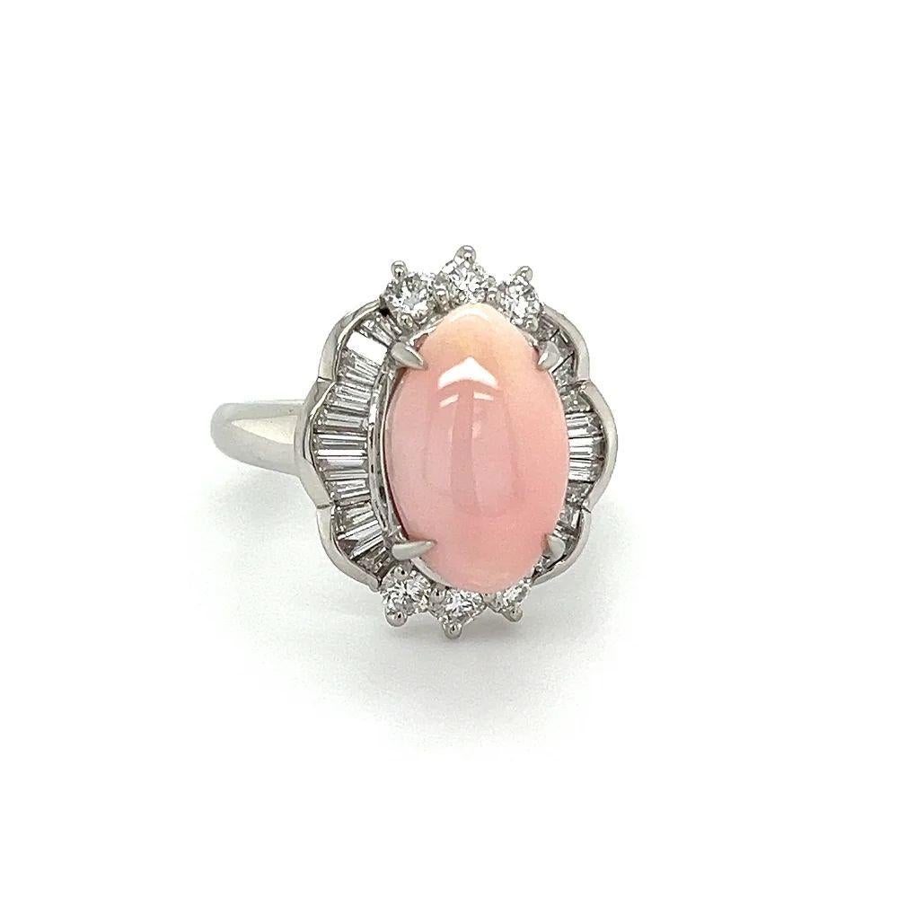 Simply Beautiful! Vintage 5.15 Carat Natural Pink Conch Pearl and Diamond Platinum Cocktail Ring. Centering a securely nestled, Hand set 5.15 Carat Natural Pink Conch Pearl. Surrounded by a Halo of Sparkling Baguette and Round Brilliant Cut
