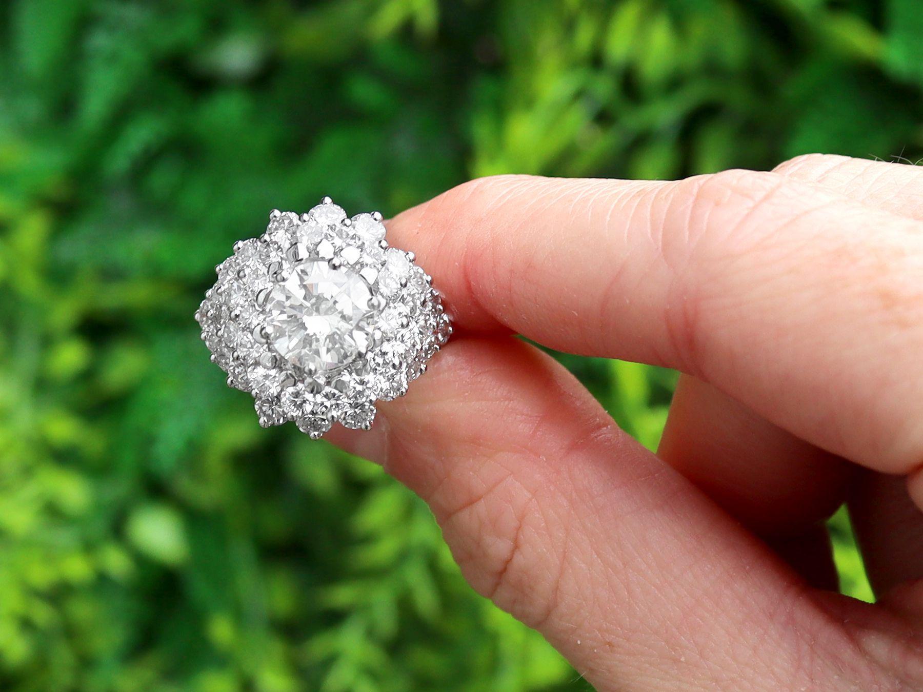 A stunning, fine and impressive vintage French 5.19 carat diamond and 18 karat white gold cluster ring; part of our diverse diamond jewellery and estate jewelry collections.

This stunning, fine and impressive diamond cluster ring has been crafted