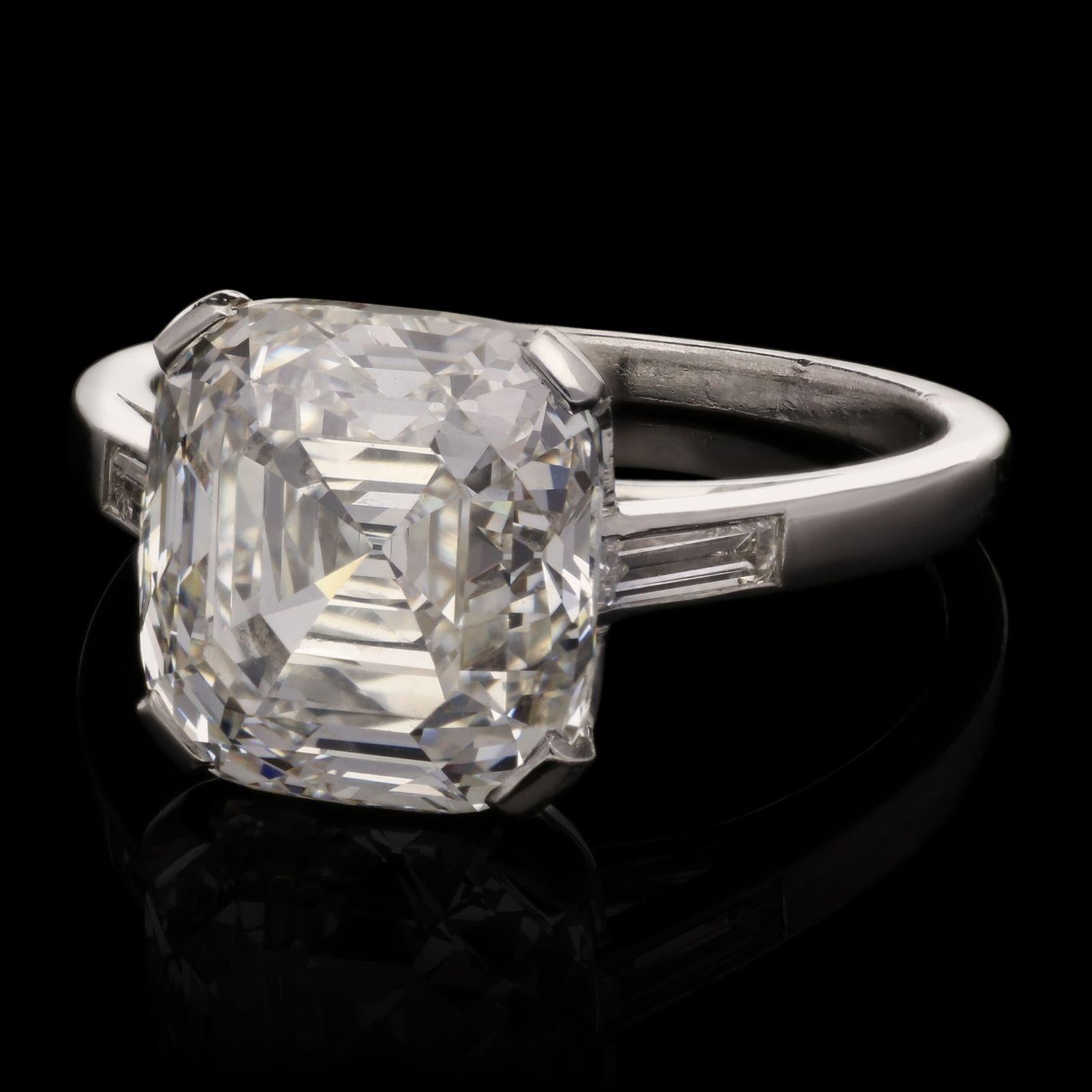 A beautiful vintage diamond and platinum ring c.1930s, centred with a wonderfully unusual mixed cut diamond, the rectangular cushion shape with a combination of brilliant and step cut faceting, weighing 5.24cts and of H colour and VS1 clarity,