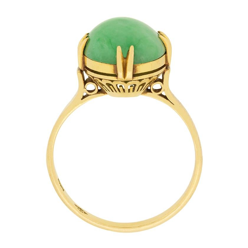 This vibrant natural jade cabochon is held within its 18 carat gold setting. The jade is natural, with no evidence of treatment, and is a lovely green colour. It is claw set in the 18 carat gold setting, which has lovely detailing on the gallery.