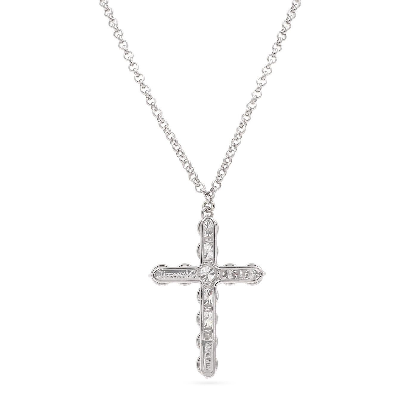 A rare 5.50 Ctw. Round Brilliant Cut Diamond Cross Pendant Necklace by Tiffany & Co., composed of platinum. Set with 11 Round Brilliant Cut diamonds weighing half a carat each, for a total carat weight of approximately 5.50 carats. Diamonds are