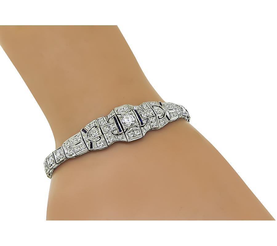 This is a fabulous platinum bracelet from the Art Deco era. The bracelet is set with sparkling old mine cut diamonds that weigh approximately 5.50ct. The color of these diamonds G-H with VS2-SI2 clarity. The bracelet measures 14mm in width at the