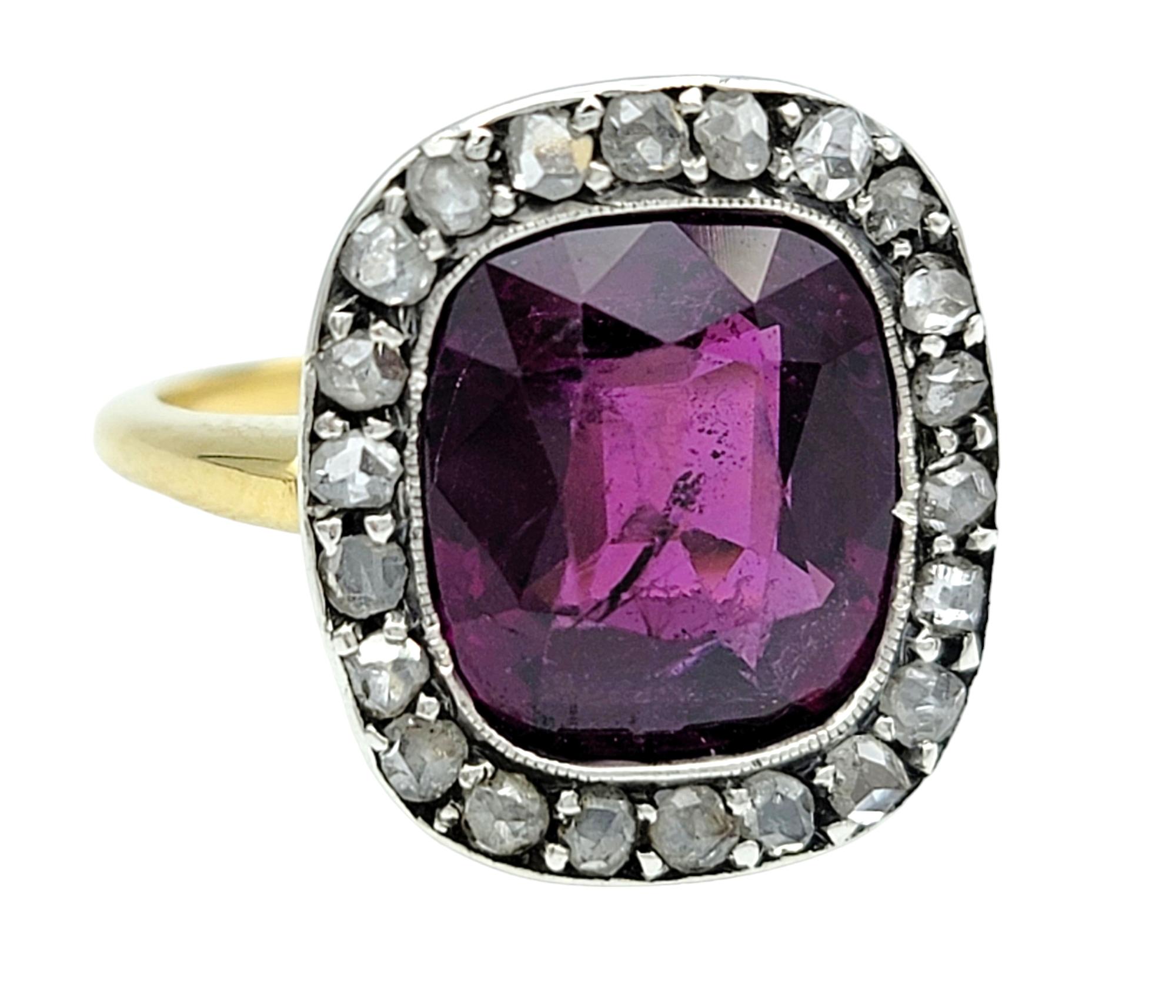 Ring Size: 7

Introducing our exquisite vintage 5.54 carat purple sapphire ring, framed by a dazzling diamond halo and set in a luxurious 18 karat white gold with a yellow gold band. The centerpiece, a magnificent purple sapphire, radiates with