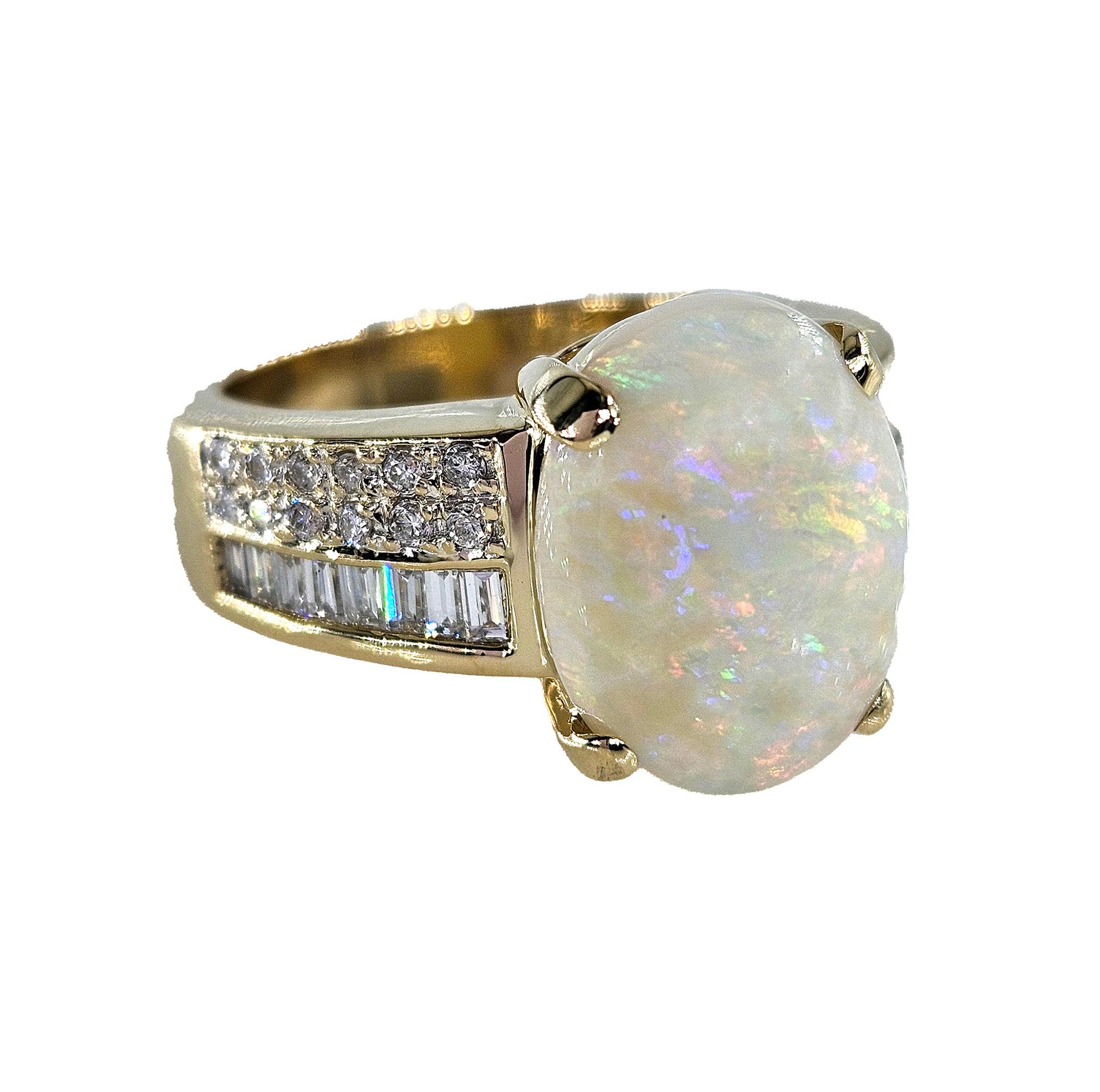 Vintage 5.54ctw Australian OPAL & Round Baguette Diamond 14k Yellow Gold Ring.
Highly prized and sought after by kings, emperors, maharajas and sultans, the majestic Opal has been desired throughout the ages. From our estate collection: An
