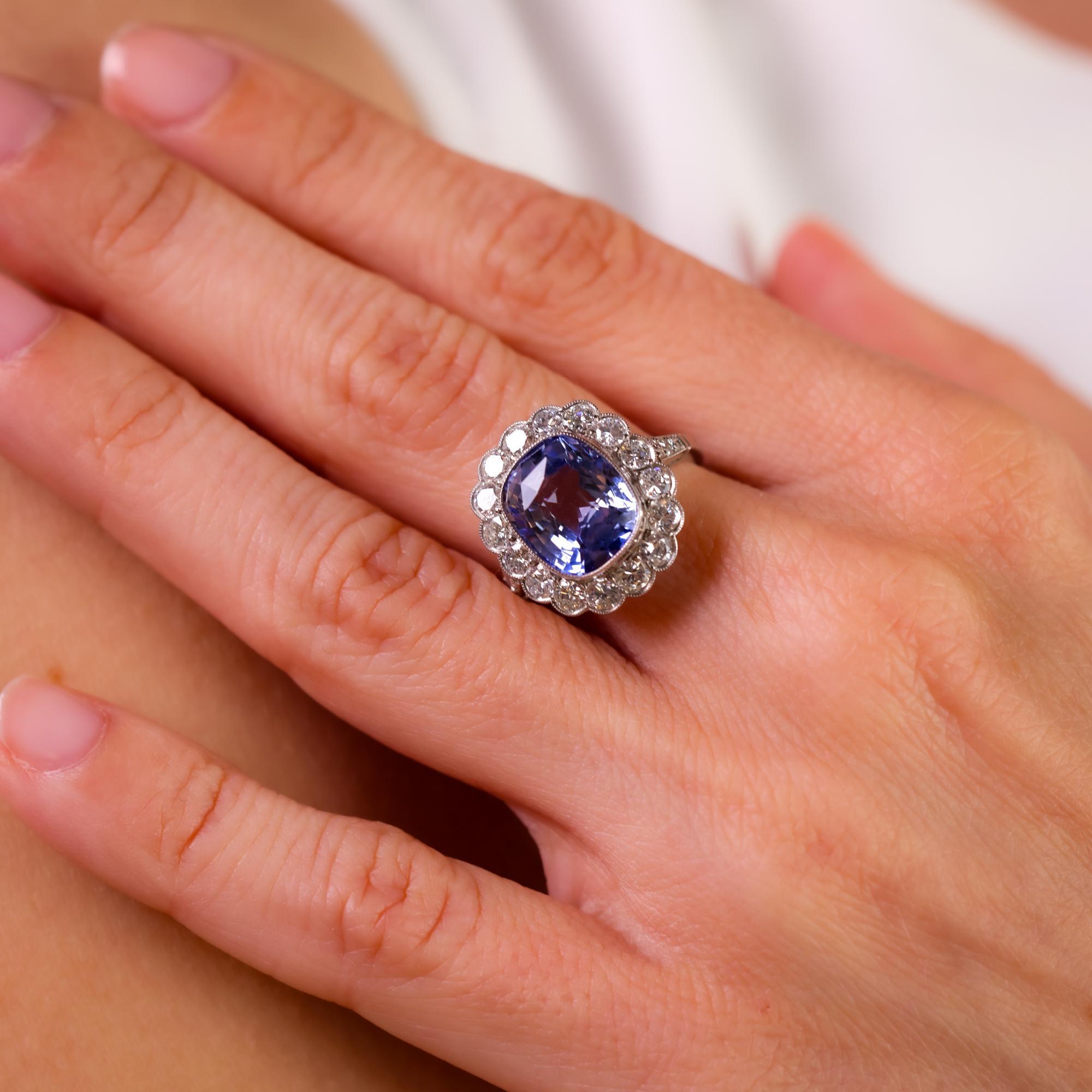 This vintage 1980s platinum ring showcases a striking 5.70 carat cushion cut sapphire, framed by 1.70 carats of dazzling diamonds for a timeless and elegant design.

Center stone: Cushion cut sapphire
Weight: Approximately 5.70 carats
Accent stone: