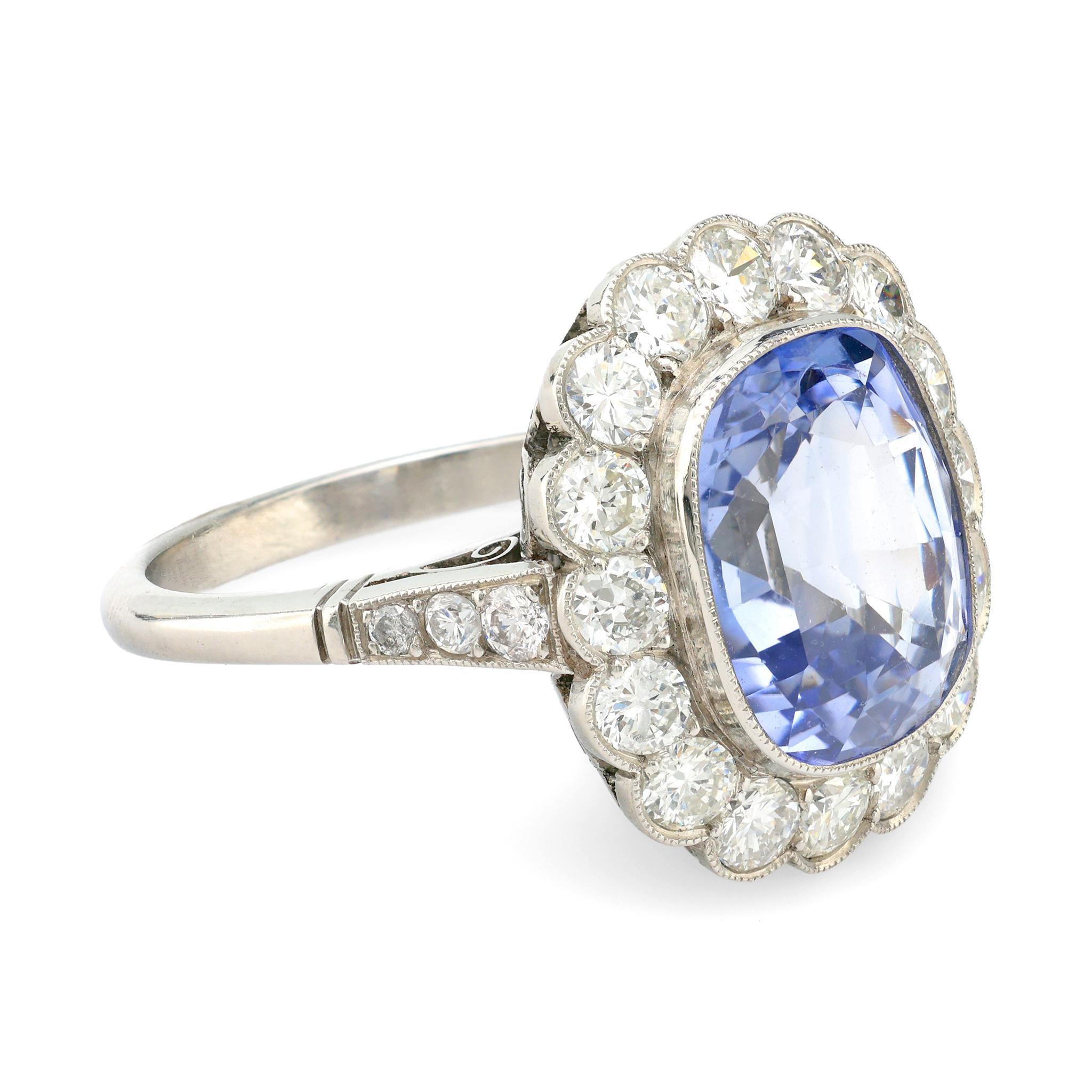 Modern Vintage 5.70 carat sapphire diamond platinum halo ring For Sale