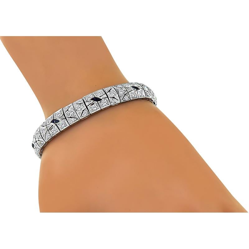 This is a beautiful platinum bracelet from the Art Deco era. The bracelet is set with sparkling old mine cut diamonds that weigh approximately 5.75ct. The color of these diamonds is F-G with VS clarity. The diamonds are accentuated by lovely