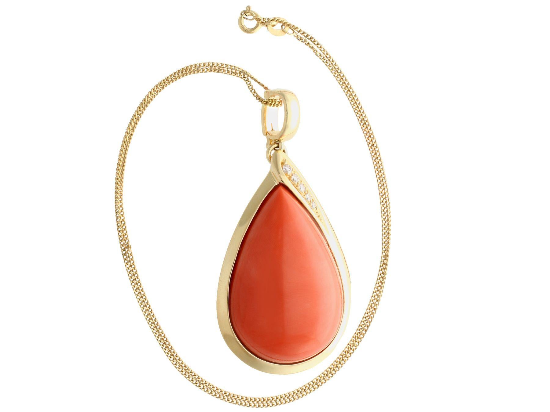 A stunning, fine and impressive, large vintage 59.14 carat coral and 0.17 carat diamond, 14k yellow gold pendant; part of our diverse vintage estate jewelry collections.

This fine and impressive vintage pendant has been crafted in 14k yellow