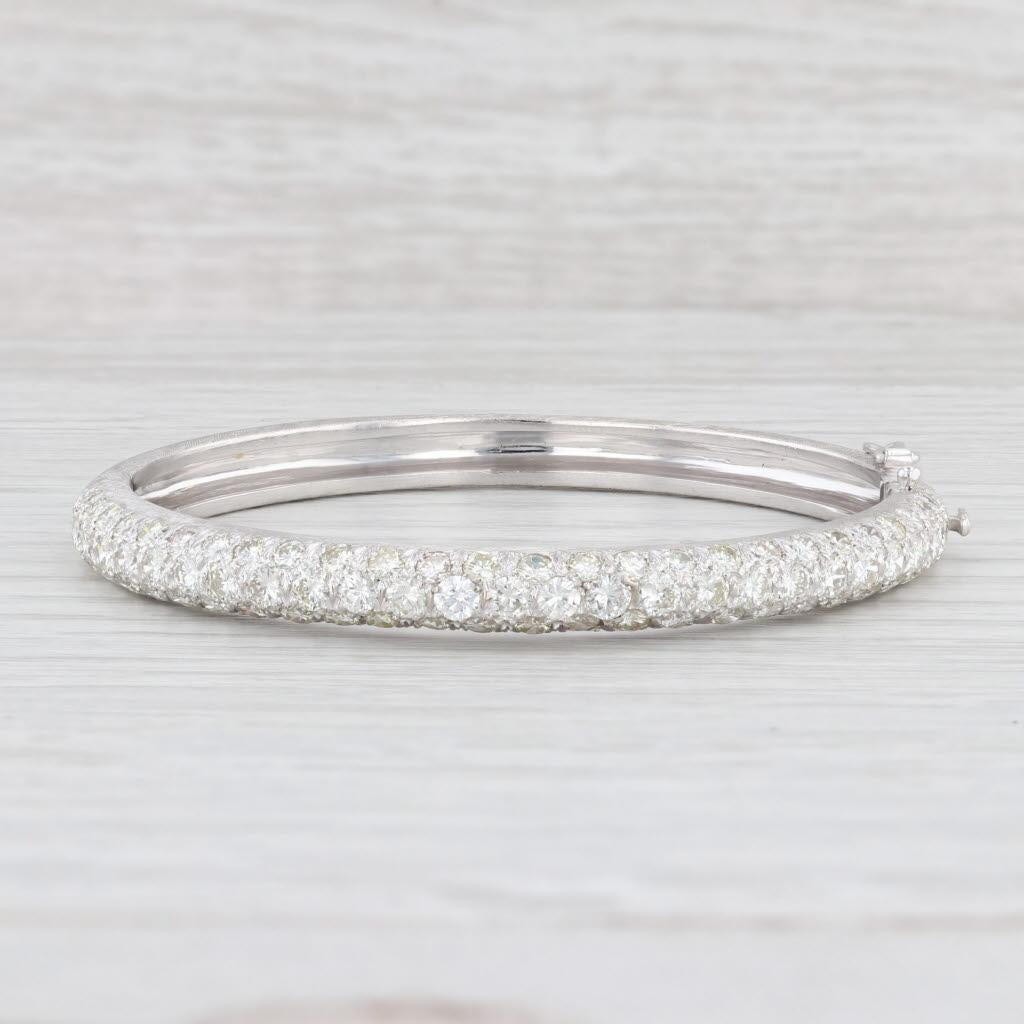 Gemstone Information:
- Natural Diamonds -
Total Carats - 5ctw
Cut - Round Brilliant
Color - K - M
Clarity - VS2 - SI1

Metal: 14k White Gold 
Weight: 22.8 Grams 
Stamps: 14k
Style: Bangle
Closure: Hinged with snap & Latch Clasp
Inner Circumference: