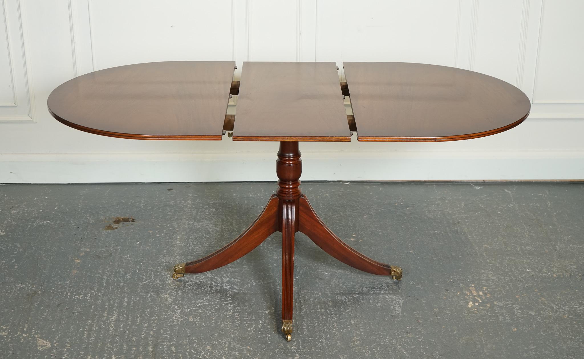 Hand-Crafted VINTAGE 6-8 SEATER EXTENDiNG DINING TABLE RAISED ON CASTORS J1 For Sale