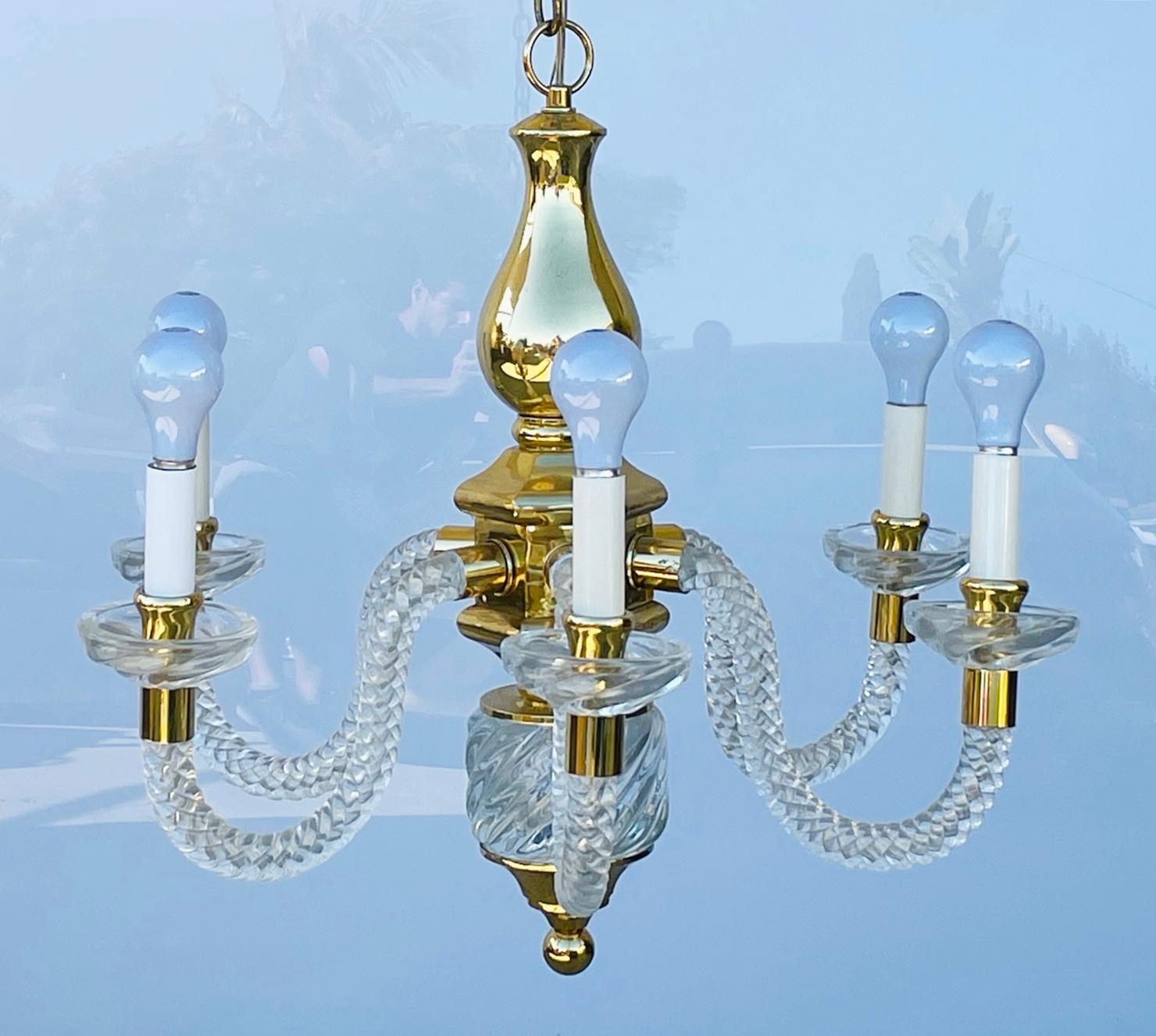Introducing the exquisite 6 Arm Murano Glass & Brass Chandelier, a stunning vintage piece originating from Italy in the glamorous era of the 1970's. This captivating chandelier effortlessly combines the timeless elegance of Murano glass