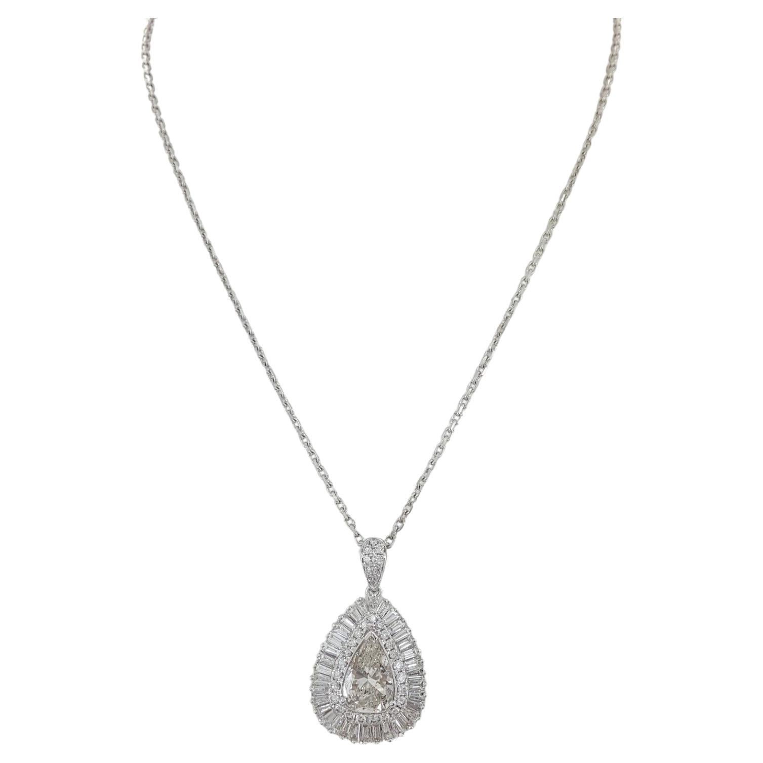Antique 6 ct Total Weight Pear Brilliant, Baguette & Round Cut Diamonds Ballerina Halo Pendant/Necklace in 18k White Gold.

Weighing 11.4 grams and measuring 16 inches in length, this necklace features a central stone—a natural pear brilliant cut