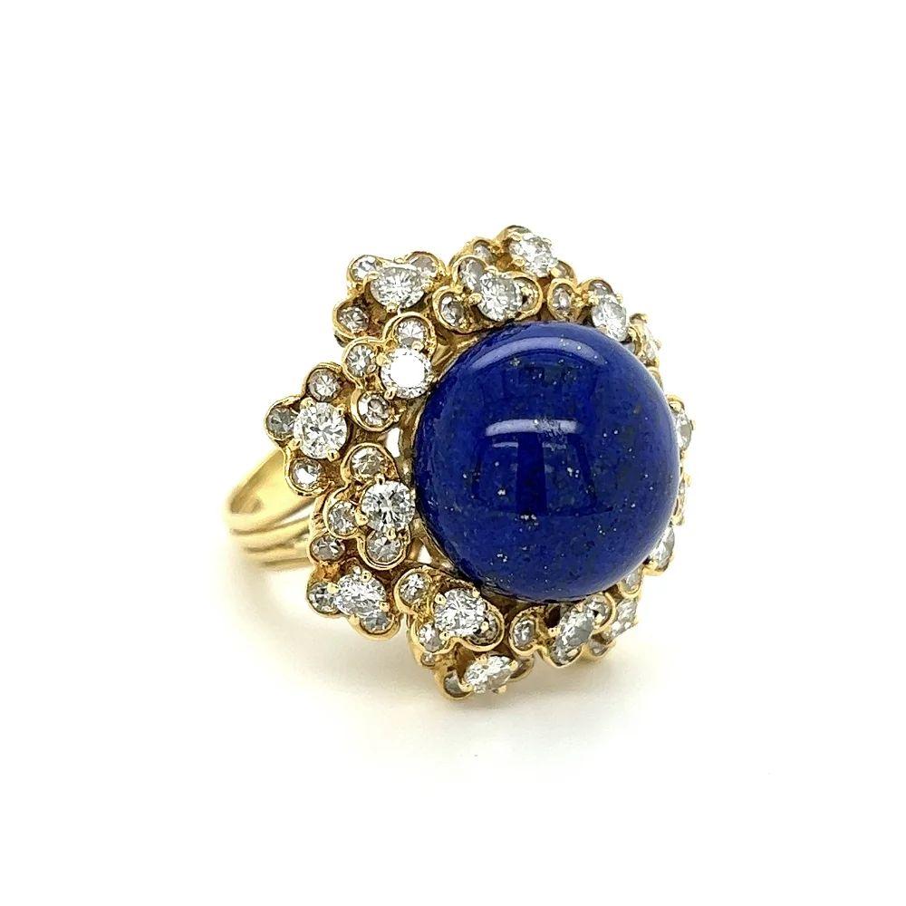 Simply Beautiful! Elegant and finely detailed Lapis Lazuli and Diamond Vintage Cluster Ring. Centering a Securely Hand set Cabochon Blue Lapis Lazuli, surrounded by Diamonds weighing approx. 3.00 total Carat weight. Hand crafted in 18 Karat yellow