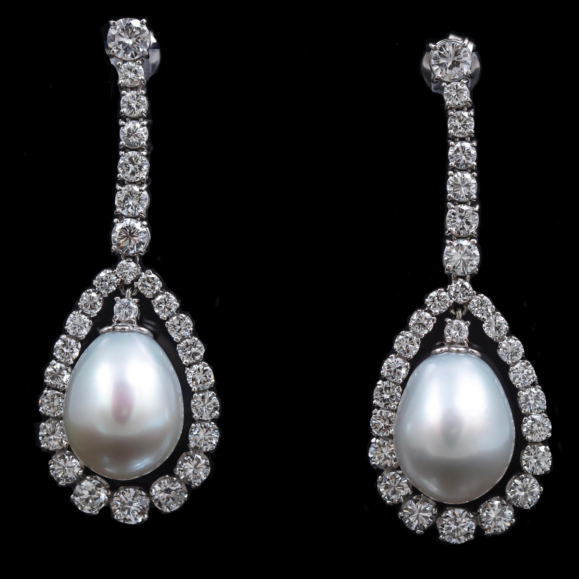 Vintage cultured pearl and diamond drop earrings in white gold, second half of the 20th century. Each earring is composed by na articulated vertical line of individually claw-set round brilliant-cut diamonds suspending a drop-shape cultured pearl