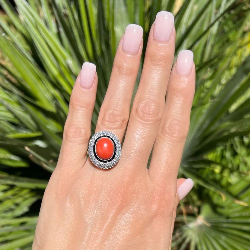 Modern Vintage 6 Carat Oval Coral Diamond and Onyx Platinum Cocktail Ring For Sale