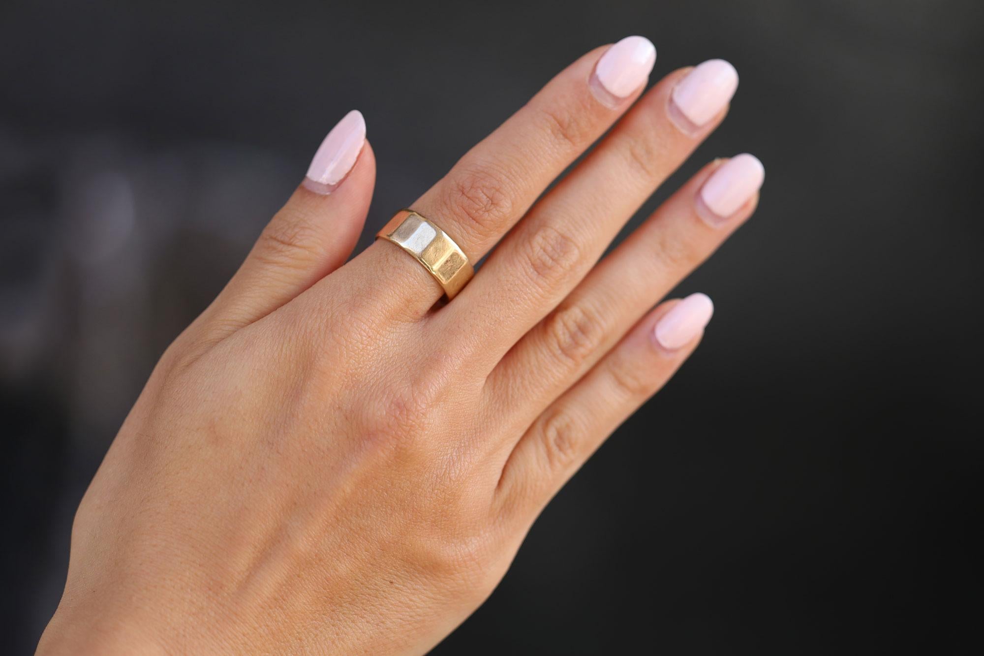 This vintage panel band will be your new favorite every-day ring. Hand crafted in 14k yellow gold, this band provides a classic look that won't break the bank. With unique Florentine detailing, the band's geometric stations add a touch of artistry
