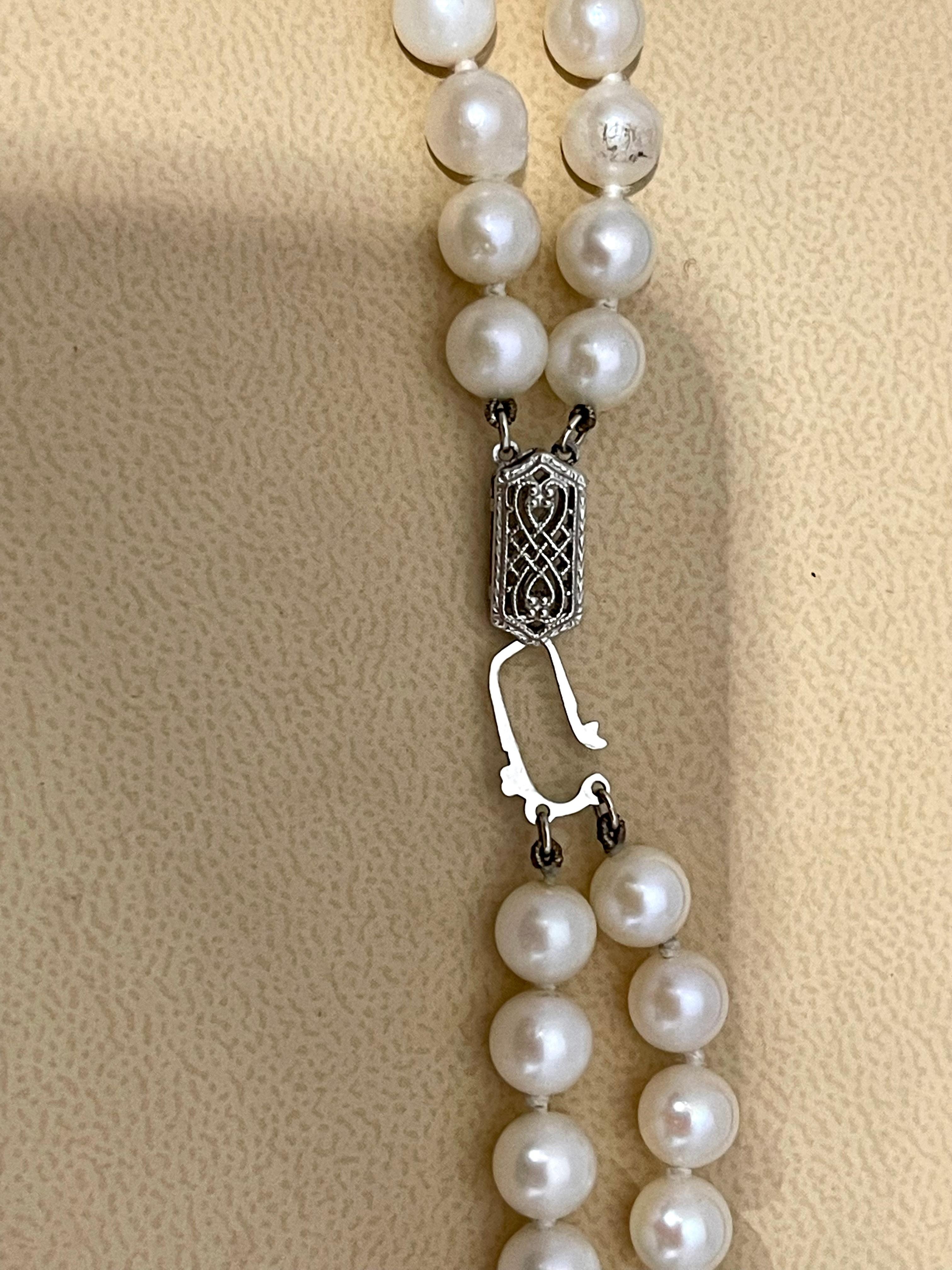 This marvelous vintage Pearl necklace features 12 row of luscious  Japanese Akoya   pearls with 14 karat White  gold Clasp

(measuring approx. 6 to 6.5 mm
 white  color
VINTAGE

PRE-OWNED 
 ESTATE PIECE

Length of  Strand including clasp  16 