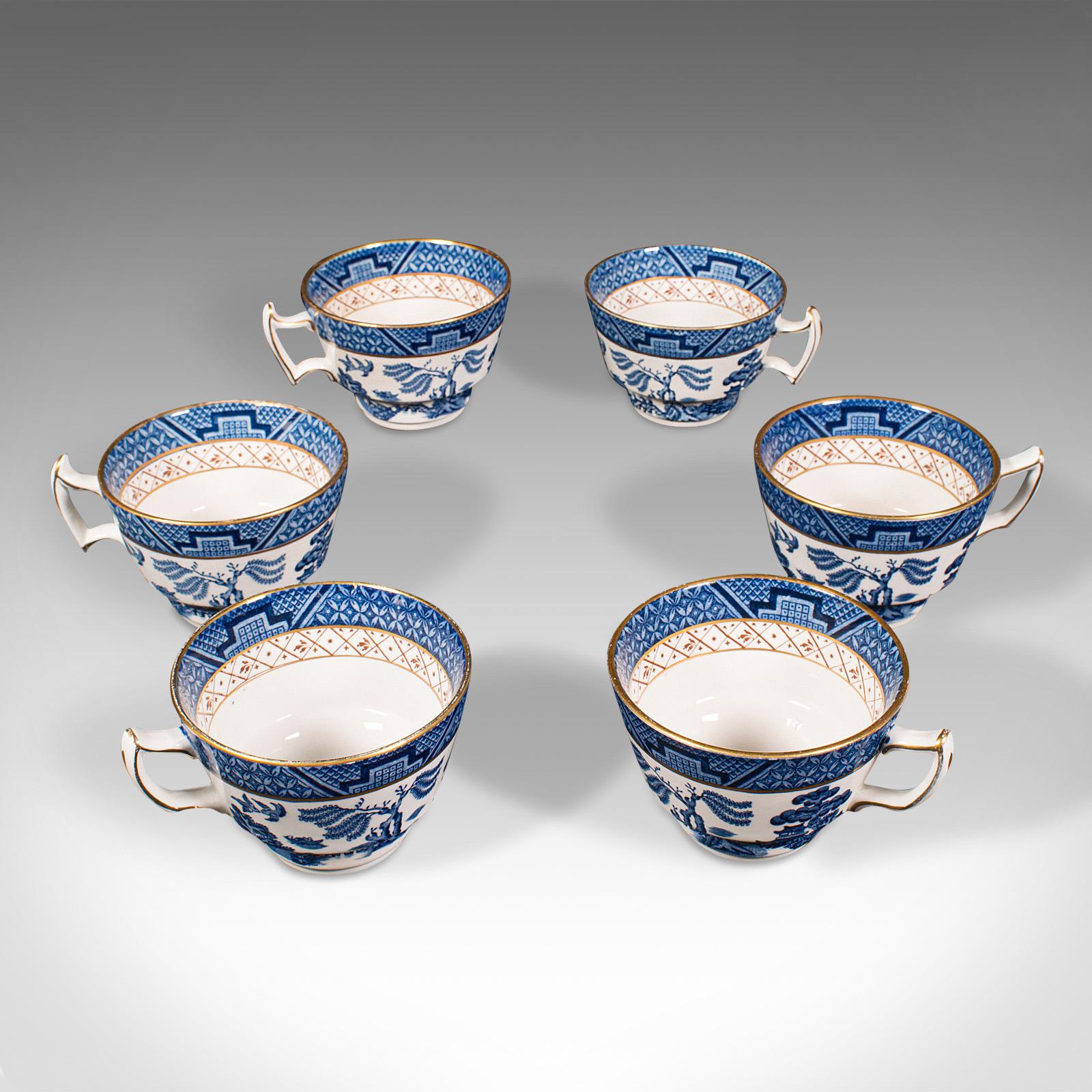 This is a vintage 6 person tea service. An English, ceramic decorative afternoon tea set with teapot and jugs, dating to the early 20th century, circa 1930.

Delightfully decorative, quality tea service, with 16 pieces total
Displaying a desirable