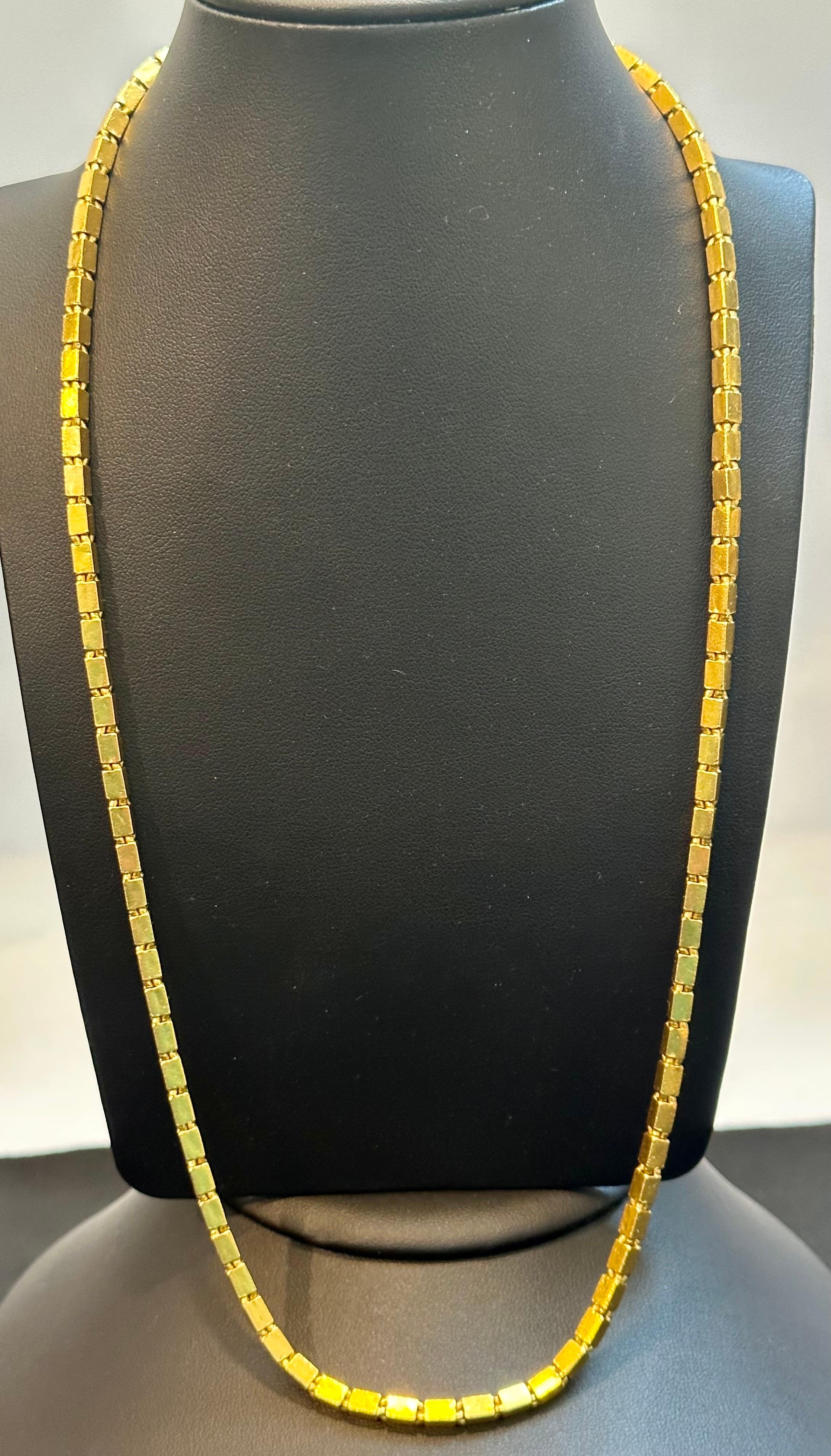 Vintage 60.6 gm Pure 24 Kt Yellow Gold Hand Made Chain , 22 inch long
 pure gold
3.6 mm wide 
Hand Made in Thailand
almost 2 OZ of pure gold 
Chain is 22 inch long so t can fit over the head and you need not to open the clasp everytime.
Simple block