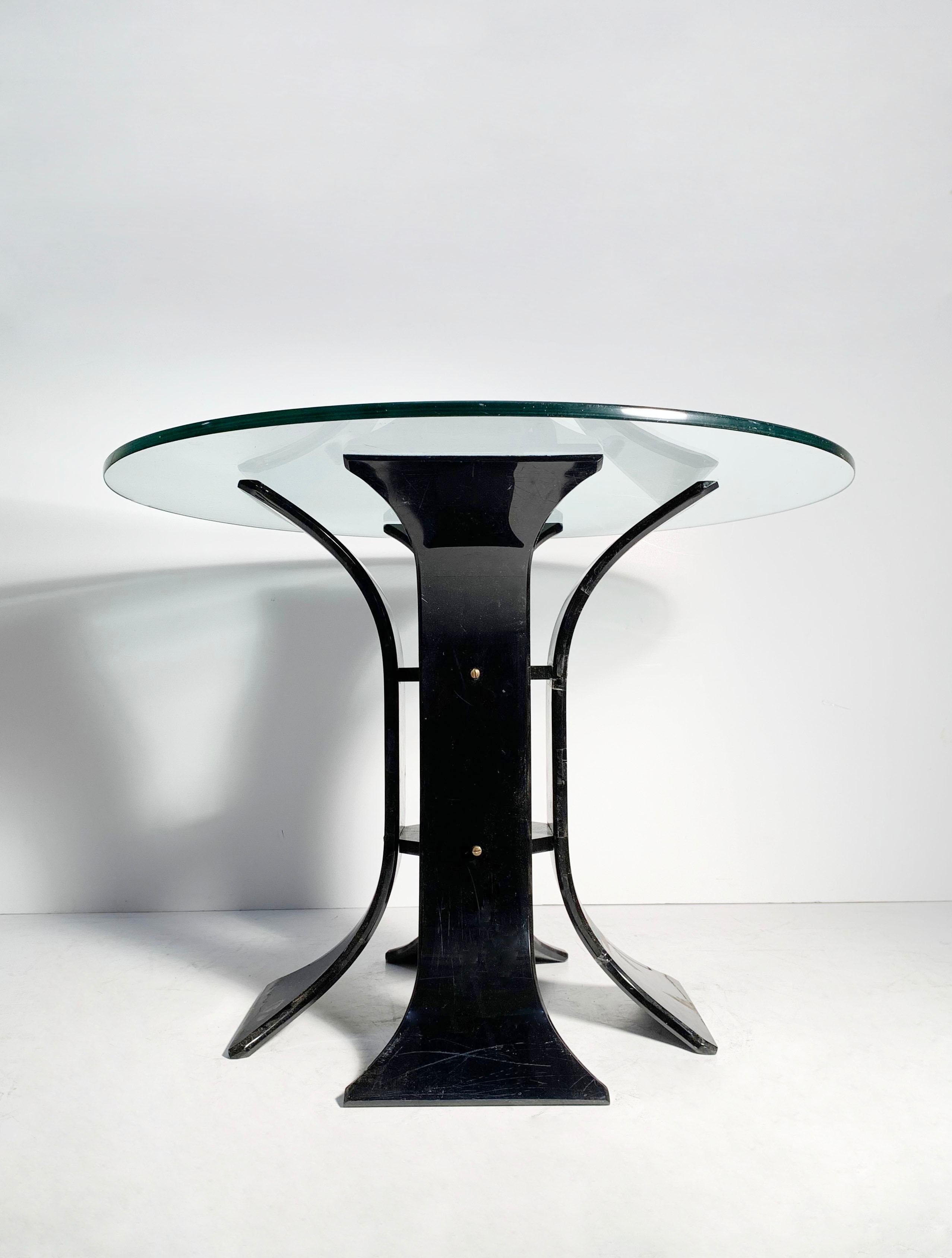 Vintage 60s / 70s black Lucite floral dinette table

Unsigned. Possibly by Lion of Frost. Or, could be Italian. The brass Fasten screws are quite nice and have not come across those before with Lion of Frost designs.

Glass top 