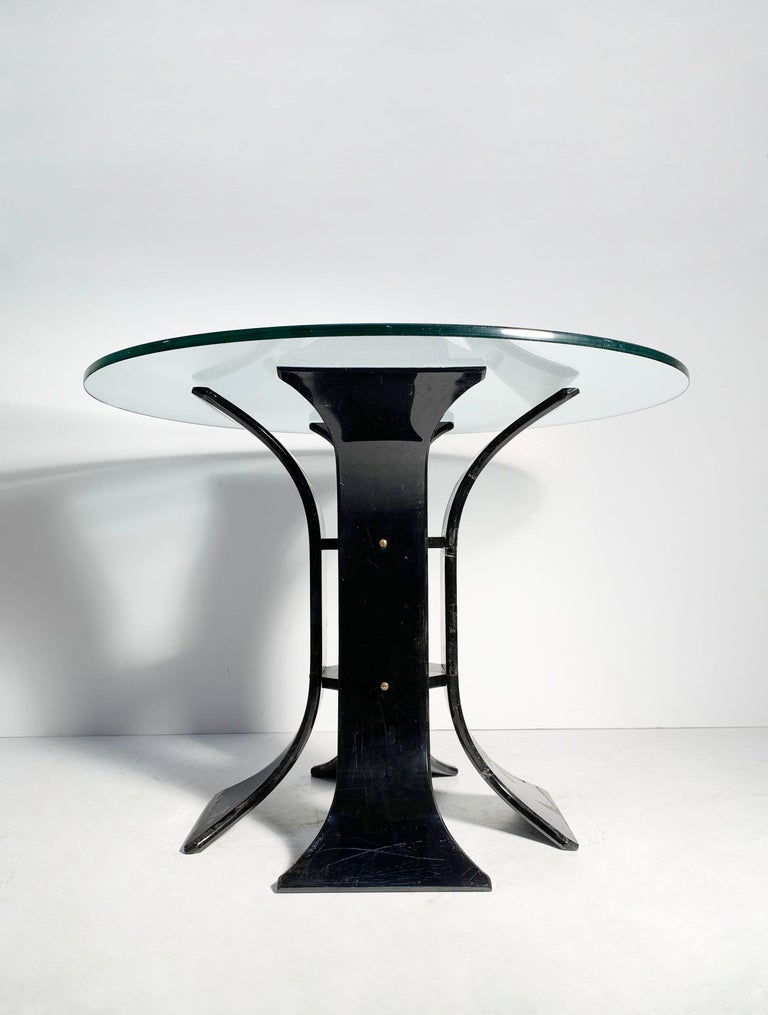 Vintage 60s / 70s black Lucite floral dinette table

Unsigned. Possibly by Lion of Frost. Or, could be Italian. The brass Fasten screws are quite nice and have not come across those before with Lion of Frost designs.

Glass top 