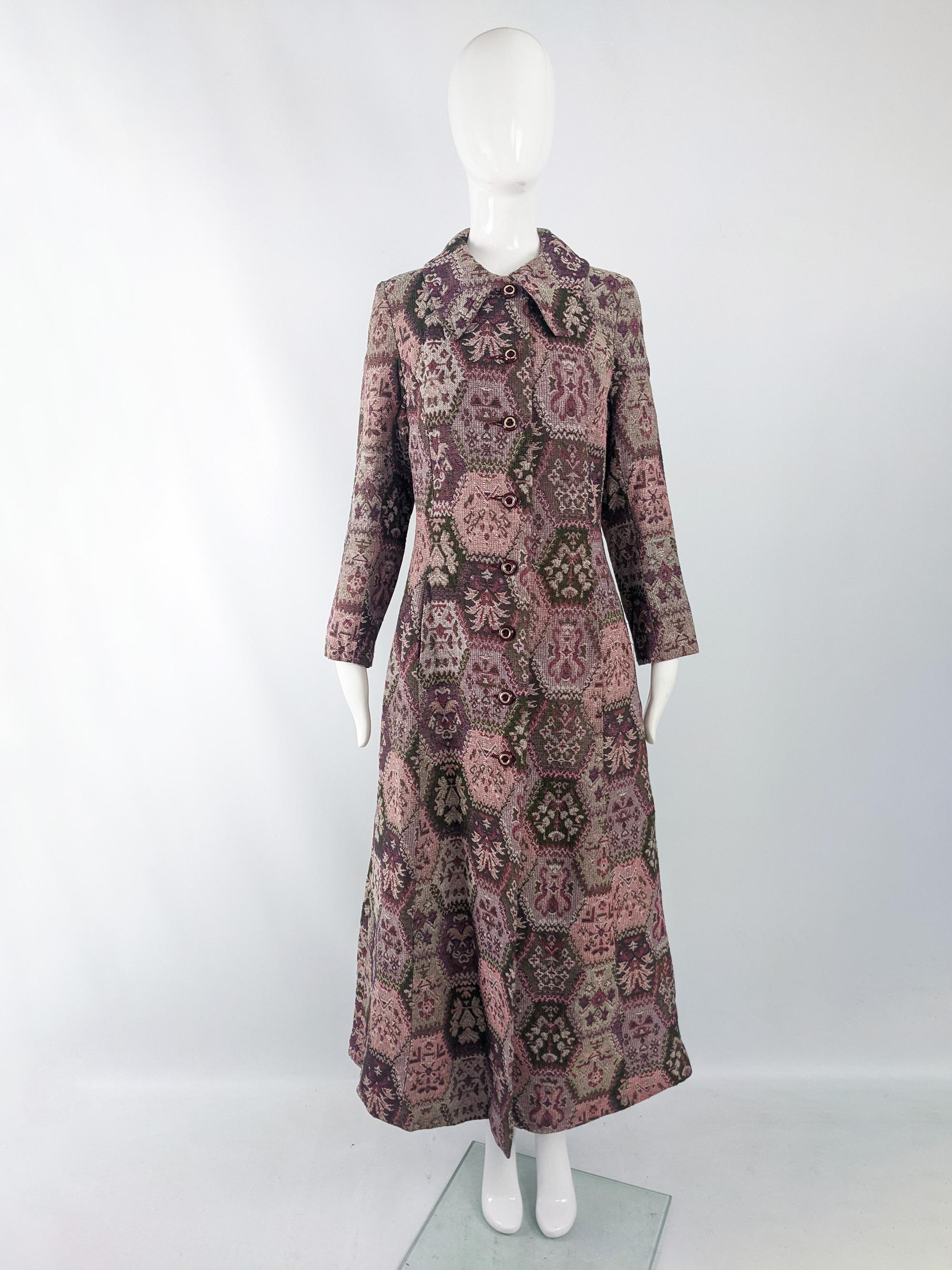 An incredible and rare vintage womens maxi coat from the late 60s / early 70s. In a beautiful tapestry fabric with a rounded collar and a long, column like cut - making the most of the wonderful fabric.

Size: Unlabelled; measures roughly like a