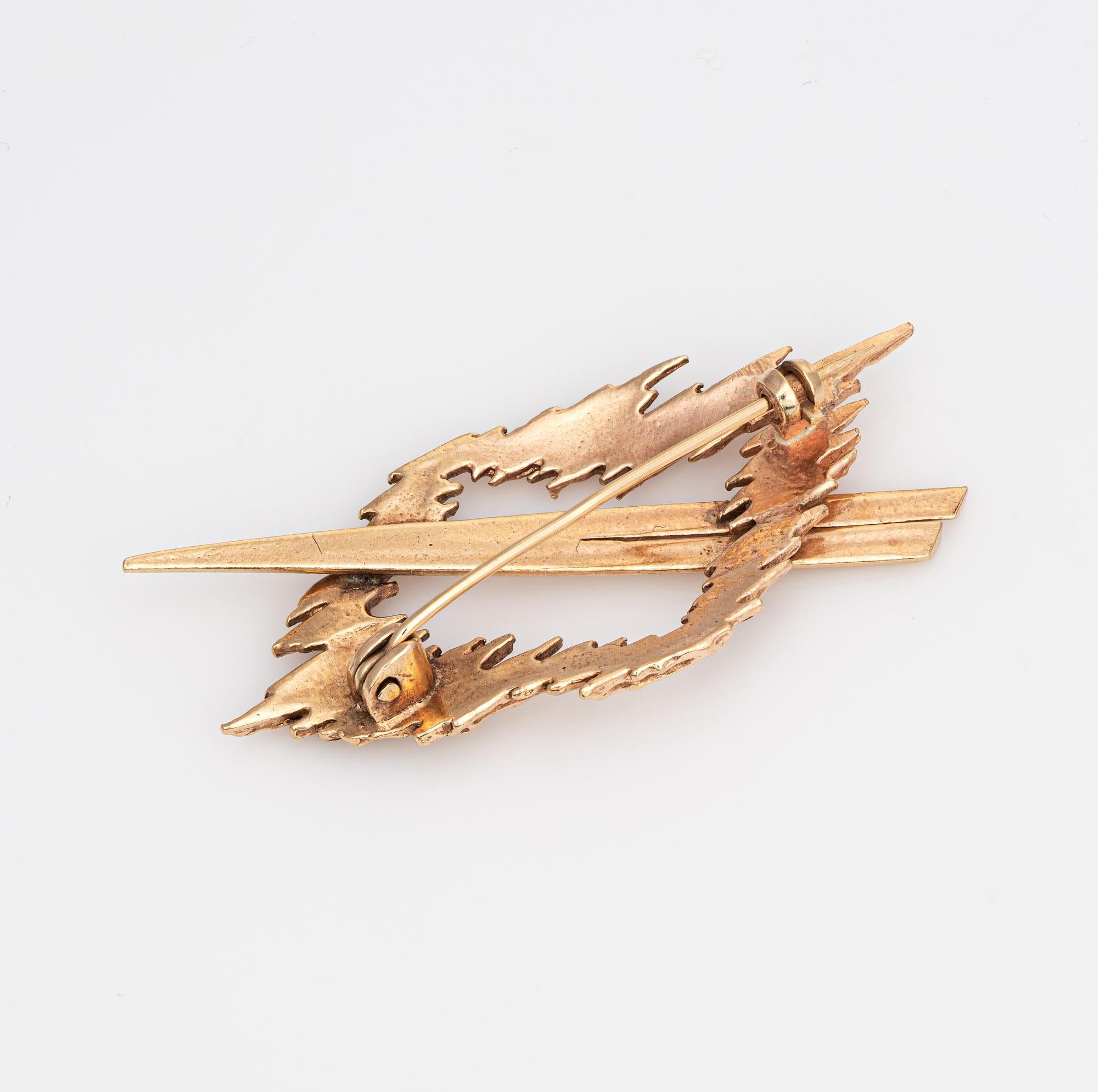 Finely detailed vintage abstract brooch (circa 1950s to 1960s) crafted in 14k yellow gold.  

The brooch highlights a striking brutalist design with a bold, unforgettable look. The organic like design was popular during the 1950s and 1960s. The