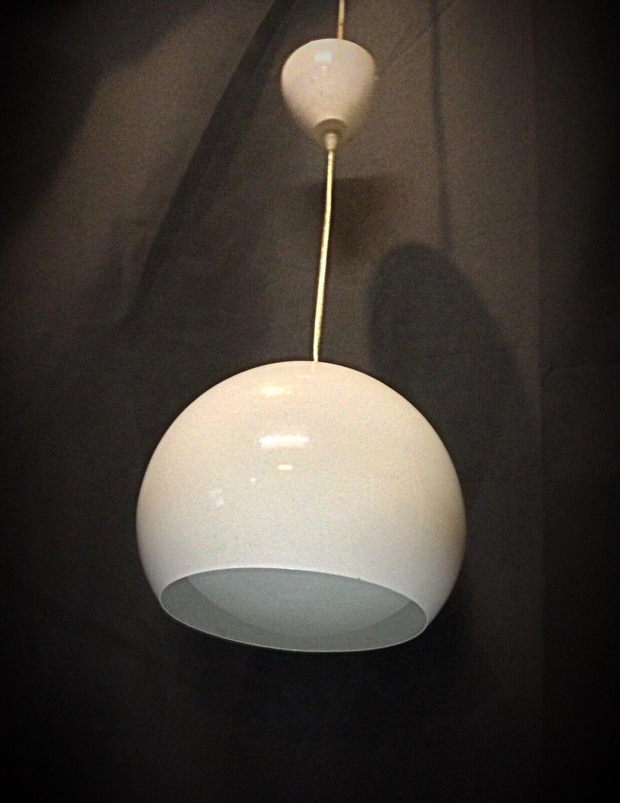 This vintage 60's enamel metal hanging lamp is a charming piece from the mid-20th century. With its classic design and durable materials, it adds a touch of retro style to any interior. The lamp has been kept in its original condition, with some