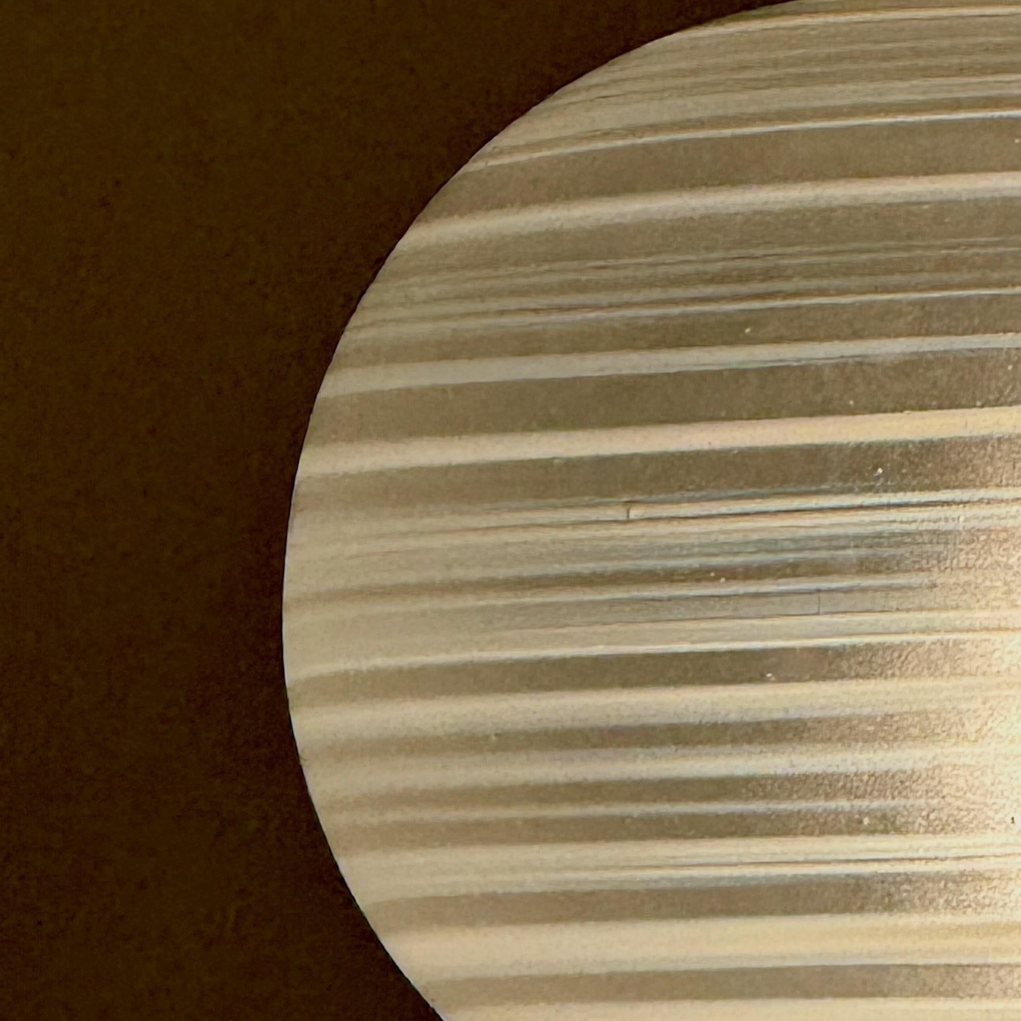 This exquisite Murano 60s lamp is a timeless masterpiece of Italian mid-century design. Its frosted Murano glass globe, adorned with delicate white spirals, emits a soft, diffused light that creates an inviting atmosphere. The solid brass base adds