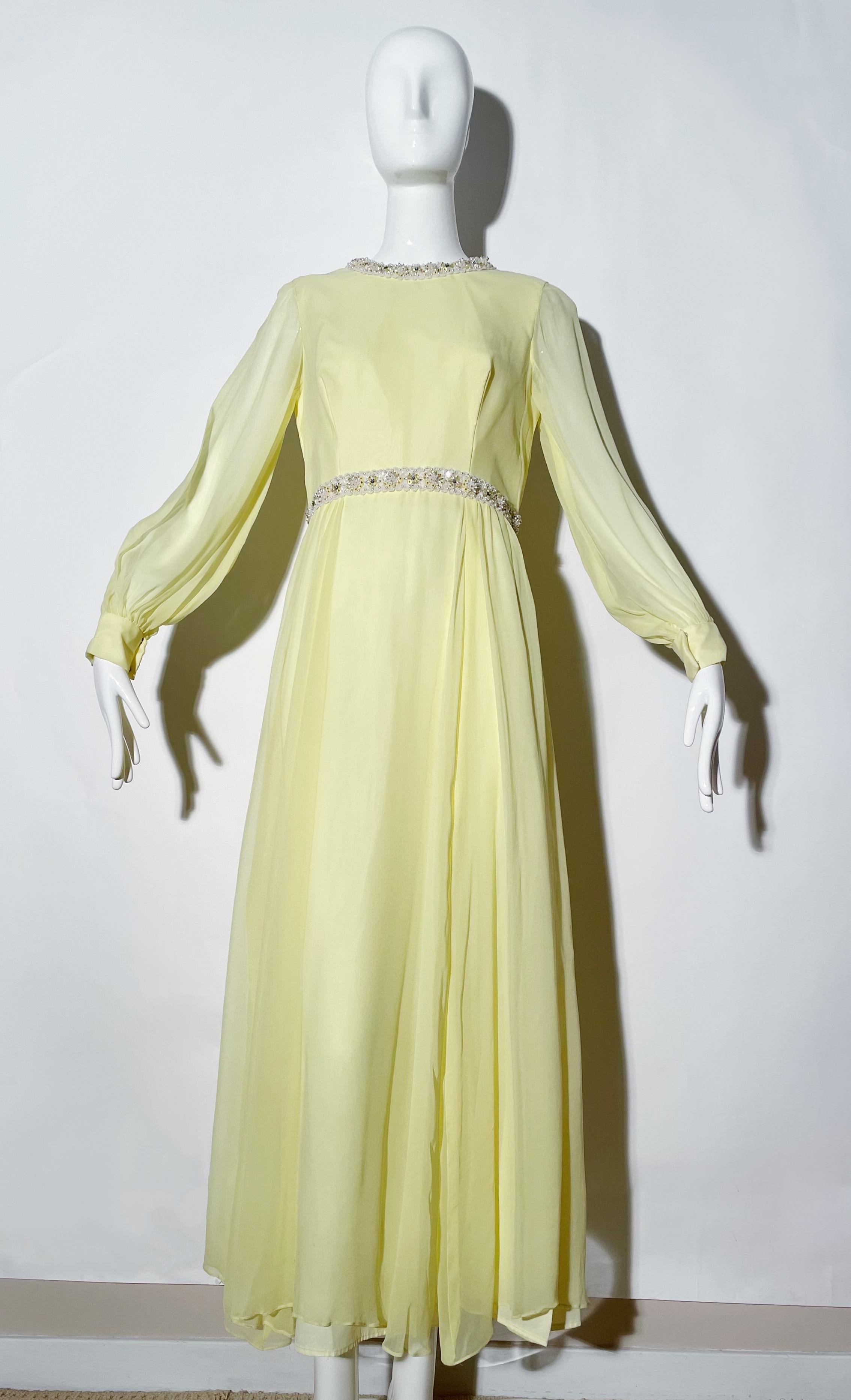 Yellow beaded gown. Longsleeve. Rear zipper closure. Silk. Lined. 
*Condition: excellent vintage condition. No visible flaws.

Measurements Taken Laying Flat (inches)—
Shoulder to Shoulder: 14 in.
Bust: 32 in.
Waist: 30 in.
Hip: 34 in.
Length: 52