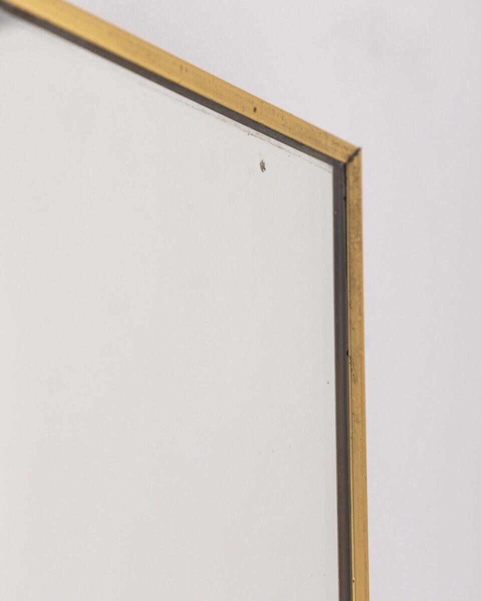 Rectangular wall mirror with brass frame, 60s.

Condition: In good condition, it shows signs of wear caused by time.

Dimensions: height 59 cm; width 48 cm; length 3 cm.

Materials: brass and glass.

Year Of Production: 60s.