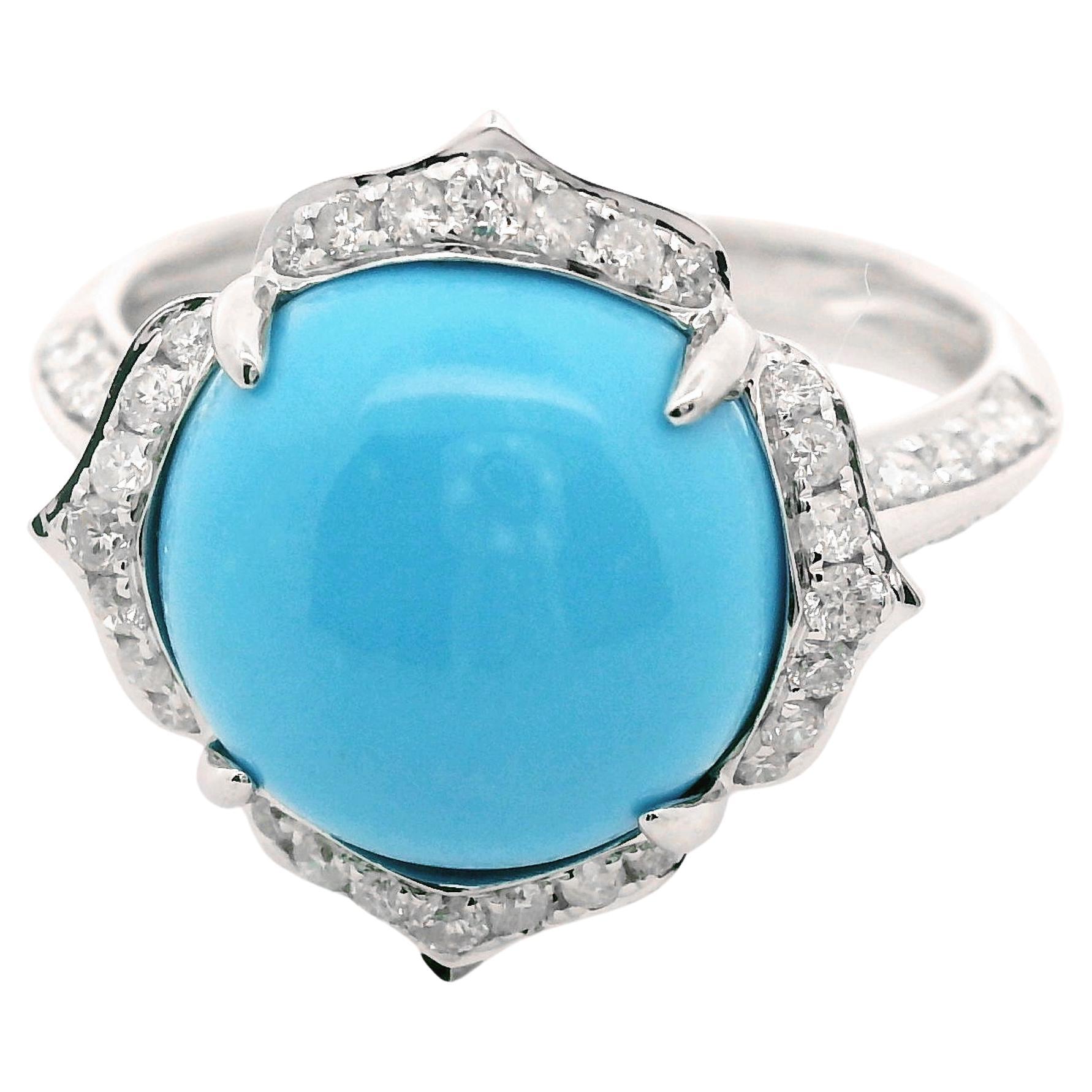 This elegant 14 Karat White Solid Gold Ring features a beautiful 6.41-carat Sleeping Beauty Turquoise, prized for its rich blue color and smooth, lustrous surface. Surrounding the sleeping Beauty Turquoise is a delicate halo of 0.26 carats of