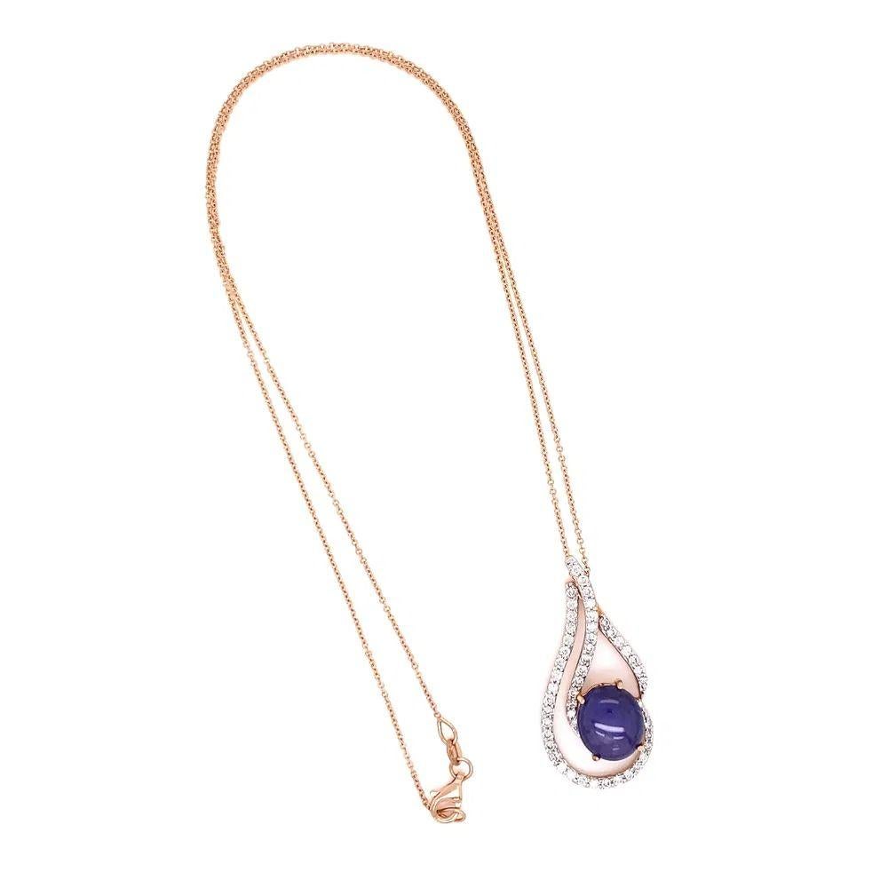 Simply Beautiful! Featuring a 6.47 Carat Oval Purple Star Sapphire and Diamond Gold Pendant Necklace. Surrounded by Diamonds, weighing approx. 0.81tcw. Pendant Dimensions: 1.39” l x 0.65” w. Hand crafted in 18K Rose Gold. Suspended from an 18” Rose